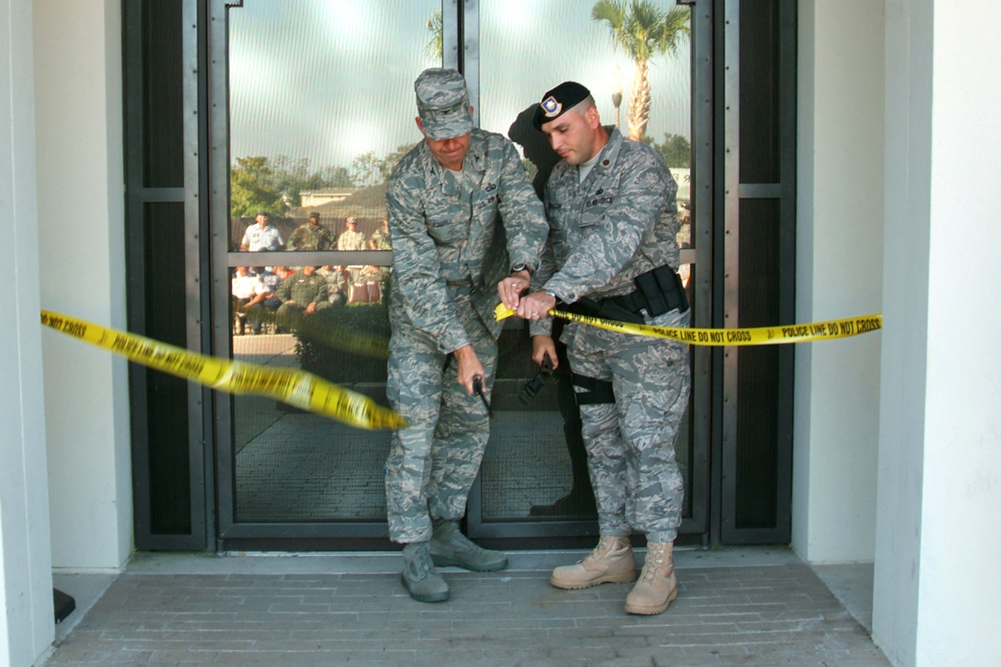 Left, Col. Greg Touhill, 81st Training Wing commander and Major Joseph Musacchia, 81st Security Forces commander cuts the ribbon during the squadron's building ribbon cutting ceremony on Monday 5 November..  The building was heavily damaged during Hurrican Katrina in August, 2005.  (U.S. Air Force photo by Adam Bond)
