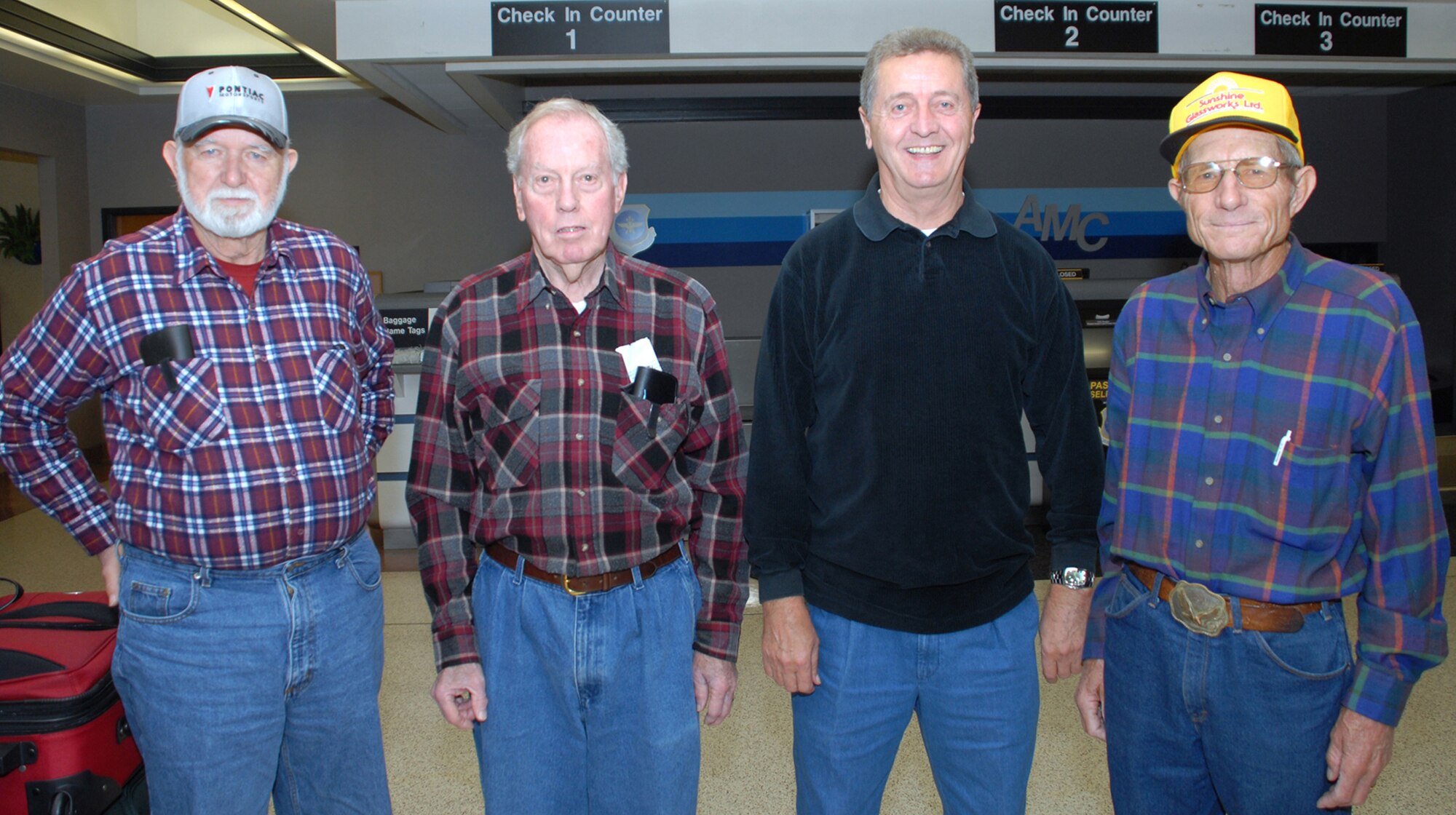 Four veterans wait at the Dover Air Force Base Air Passenger Terminal for a space-available flight to Ramstein AB, Germany. (left to right) Norman Heemer served in the Army from 1955 to '75, John Gray served in the Army from '47 to '68, John Stevens served in the Army from '58 to '79, and Wayne McDannald served in the Air Force from '56 to '62 and then completed his 20-year career in the Navy. (U.S. Air Force photo/Tech. Sgt. Kevin Wallace)