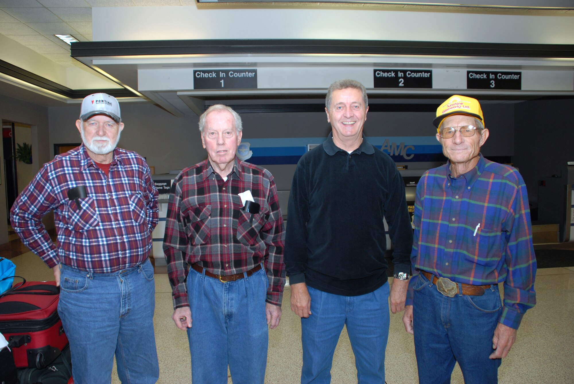 Four veterans wait at the Dover Air Force Base Air Passenger Terminal for a space-available flight to Ramstein AB, Germany. (left to right) Norman Heemer served in the Army from 1955 to '75, John Gray served in the Army from '47 to '68, John Stevens served in the Army from '58 to '79, and Wayne McDannald served in the Air Force from '56 to '62 and then completed his 20-year career in the Navy. (U.S. Air Force photo/Tech. Sgt. Kevin Wallace)