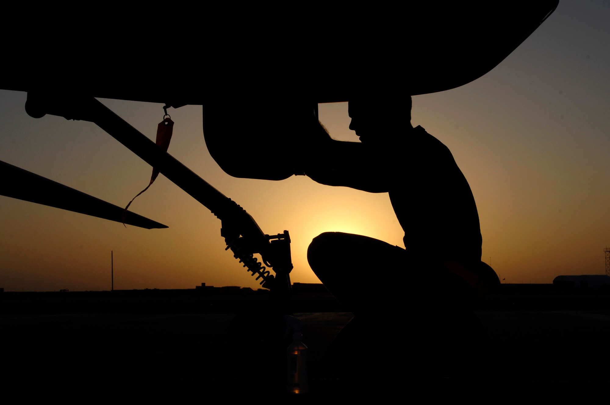 Airman 1st Class Justin Cole cleans the front sensor of an MQ-1 Predator Unmanned Aerial Vehicle Nov. 5 at Ali Base, Iraq. The Predators are now fully operational and have begun 24-hour operations. Airman Cole is deployed from Creech Air Force Base, Nev. (U.S. Air Force photo/Airman 1st Class Jonathan Snyder) 