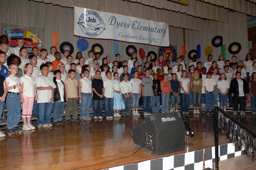 DYESS AFB, TX-- Students from Dyess Elementary School sing and dance in the school's 50th anniversary Nov. 01. The children participated in numerous musical plays ranging from the 80's all the way back to the 50's. (U.S. Air Force Photo by Airman 1st Class Micheal Breaux)