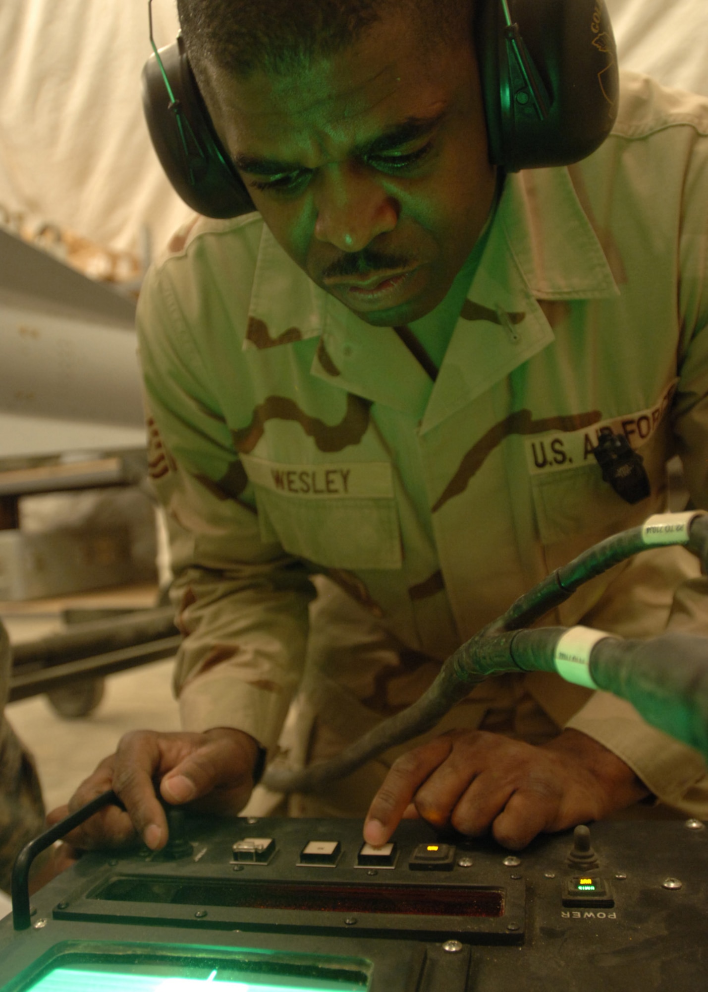 AL ASAD AIR BASE, Iraq -- Master Sgt. Allen Wesley, 438th Air Expeditionary Group munitions maintenance night-shift supervisor, uses a 157 test set to check the guide control unit on the head of a Maverick AGM-65 G-model air-guided missile here. Sergeant Wesley is deployed from the 111th Fighter Wing, Pennsylvania Air National Guard, located in Willow Grove. (U.S. Air Force photo/Tech. Sgt. D. Clare)