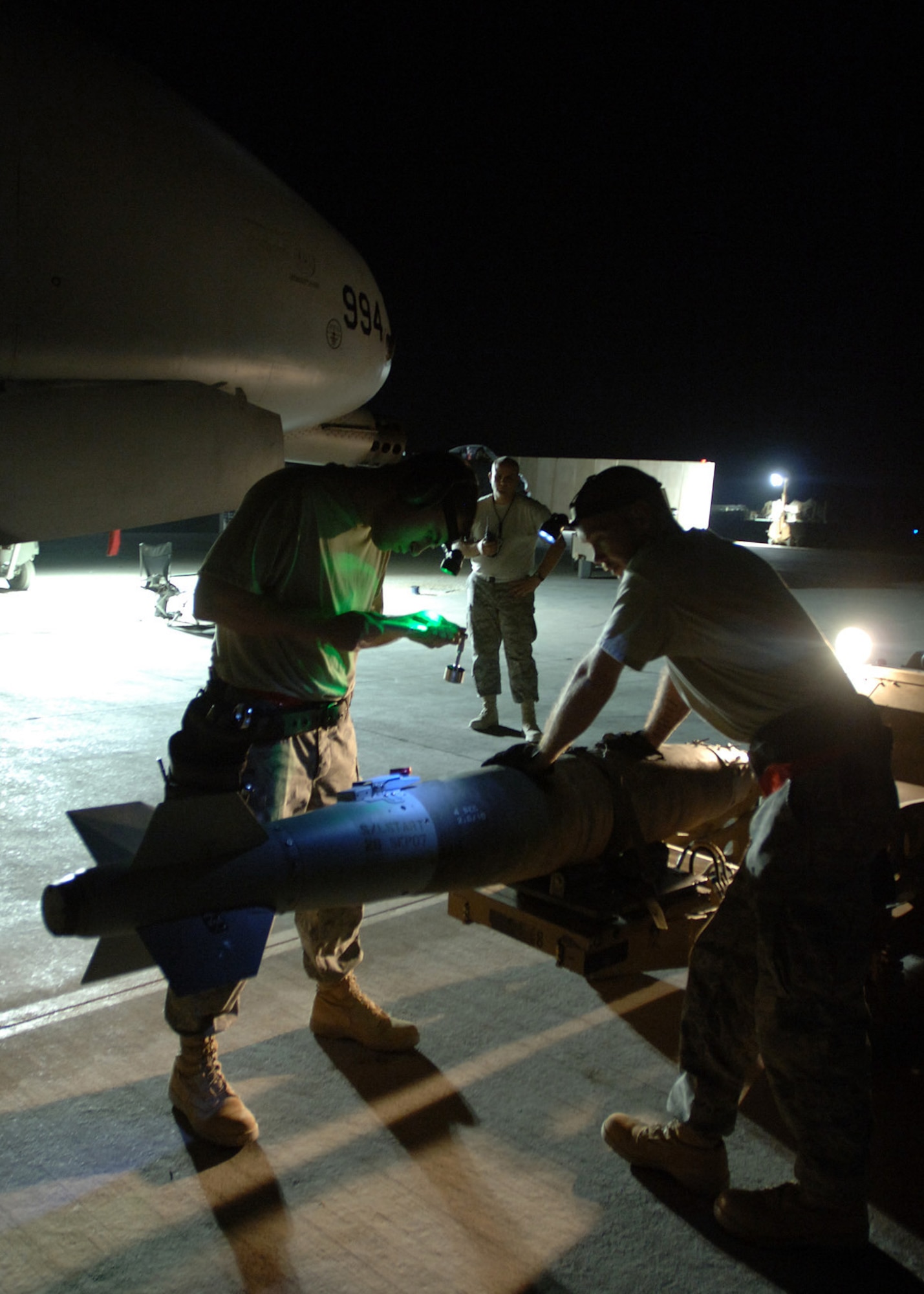 AL ASAD AIR BASE, Iraq -- Staff Sgt. Nick Draxler and Tech. Sgt. Frank Williams, 438th Air Expeditionary Group weapons loaders, verify a weapons checklist on a Joint Direct Attack Munition before loading it onto an A-10C Thunderbolt II here. Sergeants Draxler and Williams are deployed from the 175th Wing, Maryland Air National Guard, Baltimore. (U.S. Air Force photo/Tech. Sgt. D. Clare)