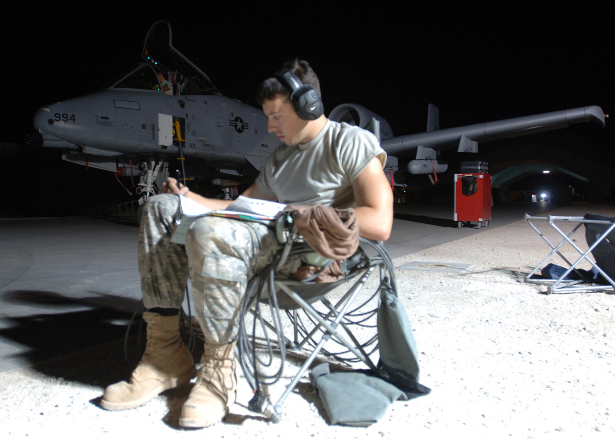 AL ASAD AIR BASE, Iraq -- Senior Airman Anthony Murray, 438th Expeditionary Group crewchief, reviews aircraft records for an A-10C Thunderbolt II here. The unit’s newly upgraded A-10C Thunderbolt IIs are the first to fly in combat. Airman Murray is deployed from the 175th Wing, Maryland Air National Guard, Baltimore. (U.S. Air Force photo/Tech. Sgt. D. Clare)