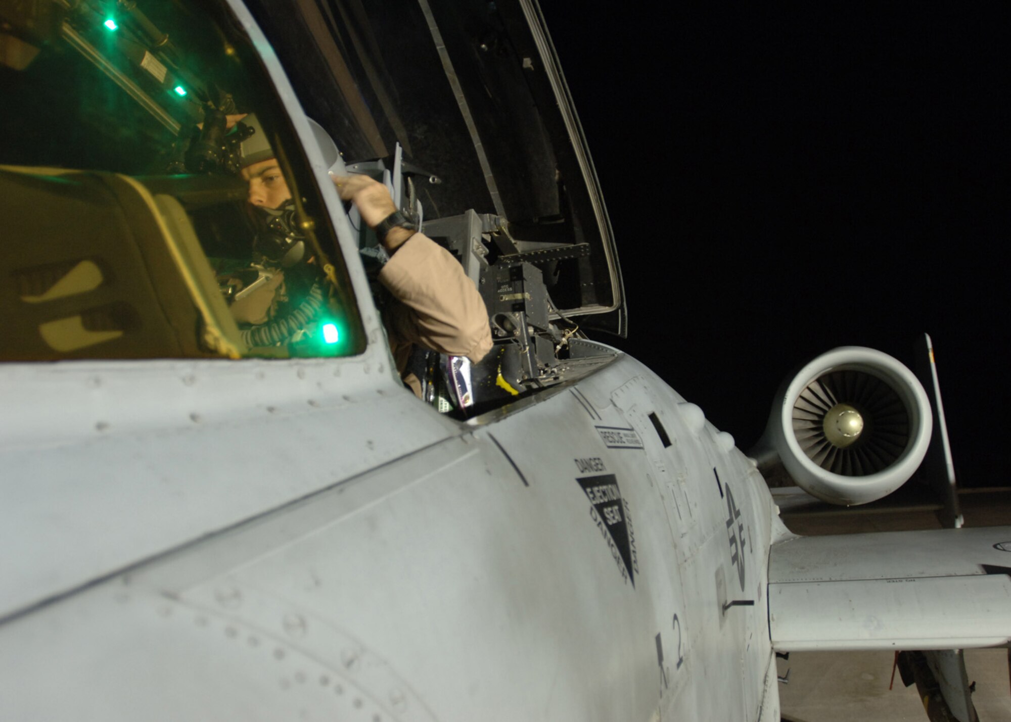 AL ASAD AIR BASE, Iraq -- First Lt. Nick Barone, 438th Air Expeditionary Group pilot, secures his helmet before taking off on a combat mission in the new A-10C Thunderbolt II here. Lieutenant Barone is deployed from the 175th Wing, Maryland Air National Guard, Baltimore. (U.S. Air Force photo/Tech. Sgt. D. Clare)