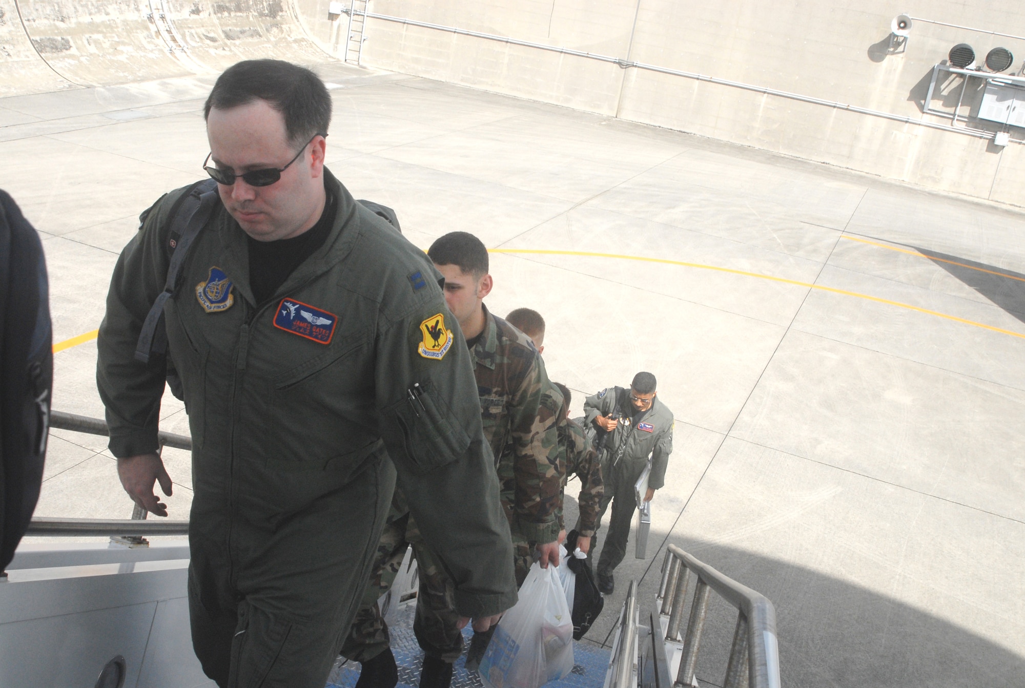 Members of the 961st Airborne Air Control Squadron board an E-3 AWACS at Kadena Air Base, Japan, Nov. 5, 2007, to participate in Keen Sword. Several hundred Kadena members are participating in the bilateral joint service exercise, including about 80 members of the 961st AACS. (U.S. Air Force photo/Master Sgt. Jeffery Loftin)