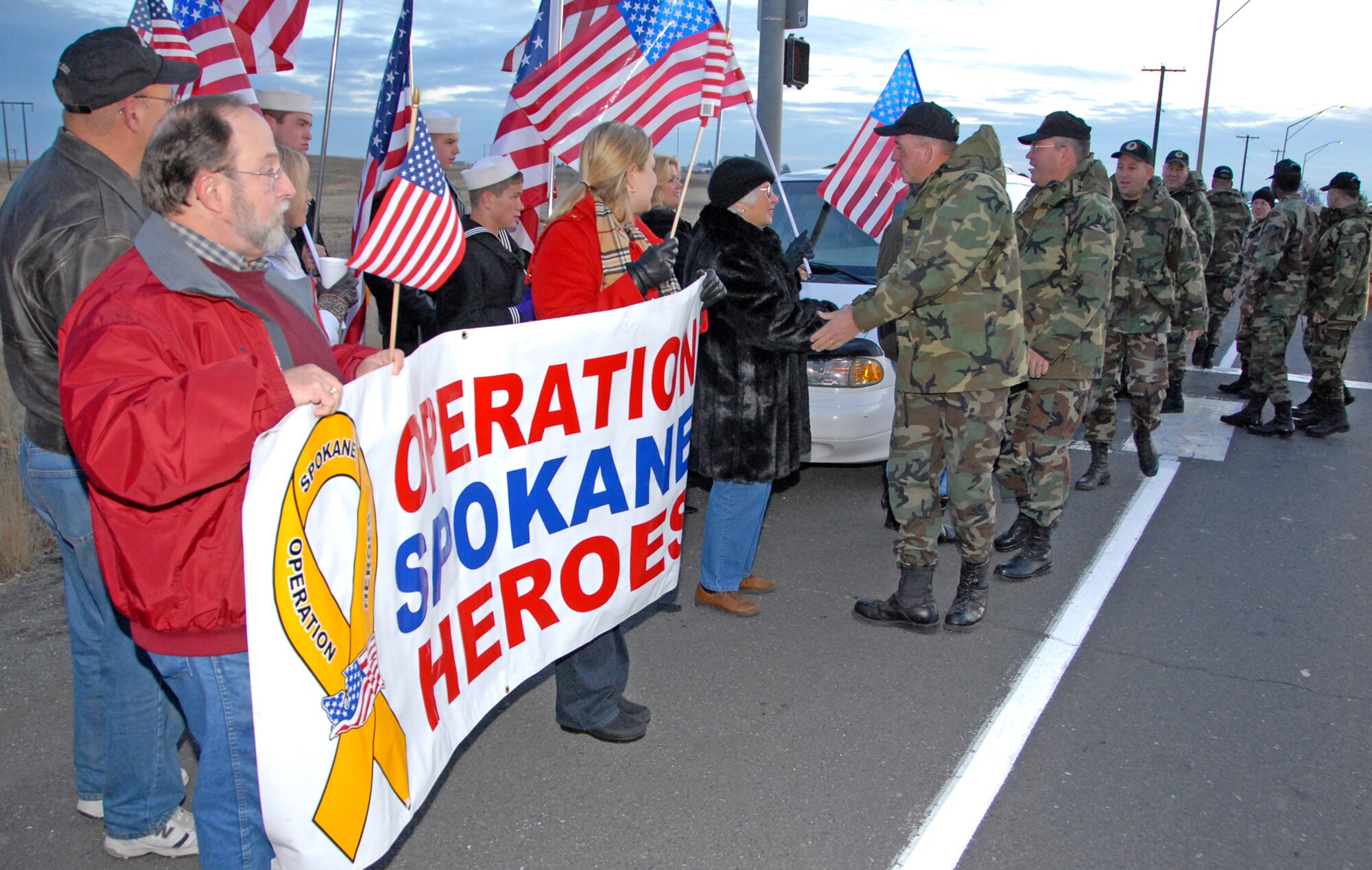 FAIRCHILD AIR FORCE BASE, Wash. – Airmen from the 141st Air Refueling Wing, Washington Air National Guard, interact with members of the Operation Spokane Heroes. OSH members gathered at Fairchild’s main gate to greet ANG Airmen as they reported for weekend drill Nov. 3. (U.S. Air Force photo / Senior Airman Anthony Ennamorato)