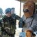 Staff Sgt. Vanessa C. Agcamaran, left, Tech. Sgt. Emmett Mack, Center, and McGruff, the Crime Dog, check visitor identification at the main gate Nov. 1. The 316th Security Forces Squadron conducts routine security spot checks. (US Air Force/Bobby Jones)