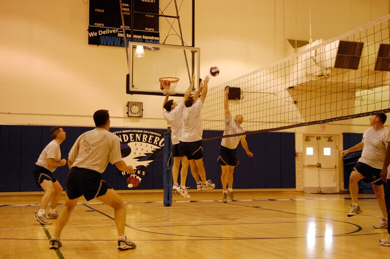 VANDENBERG AIR FORCE BASE, Calif, -- Members of the Eagles try to block a spike from the Chiefs during an Eagles vs. Chiefs Volleyball game in the Vandenberg Fitness Center Nov. 6.  This is the first Eagles vs. Chiefs game of its kind since Col. Steve Tanous took command of the 30th Space Wing.  (U.S. Air Force photo/Airman 1st Class Cole Presley)