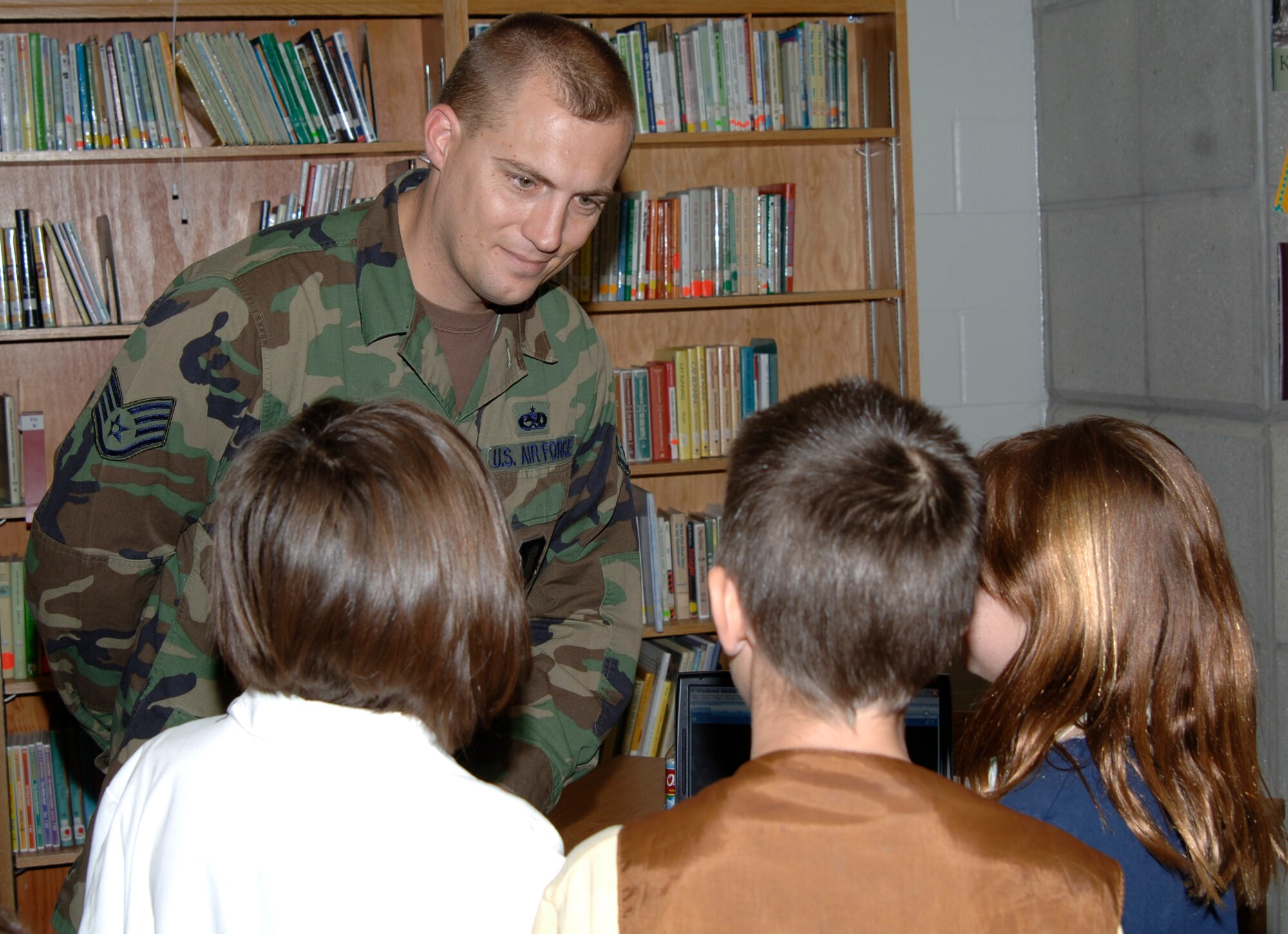 MCCONNELL AIR FORCE BASE, Kan. -- Staff Sgt. Timothy Holtorf, 22nd Aircraft Maintenance Squadron, speaks to Linwood Elementary School students about the Air Force for Career Day held at Linwood Elementary Oct. 31. Career Day is a way to show the children of Linwood Elementary School what careers are available. (Photo by Airman 1st Class Roy Lynch) 