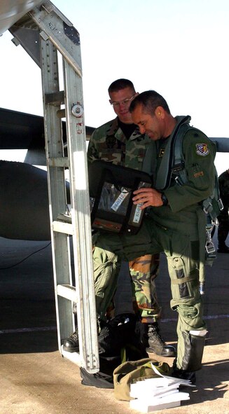 Airman 1st Class Jeremy Meyers and Lt. Col. Kurt Gallegos review procedures before flight. Airman Meyers was able to meet Colonel Gallegos and was also given the opportunity to work as his crew chief for the day. (U.S. Air Force photo/Senior Airman Stefanie Torres) 