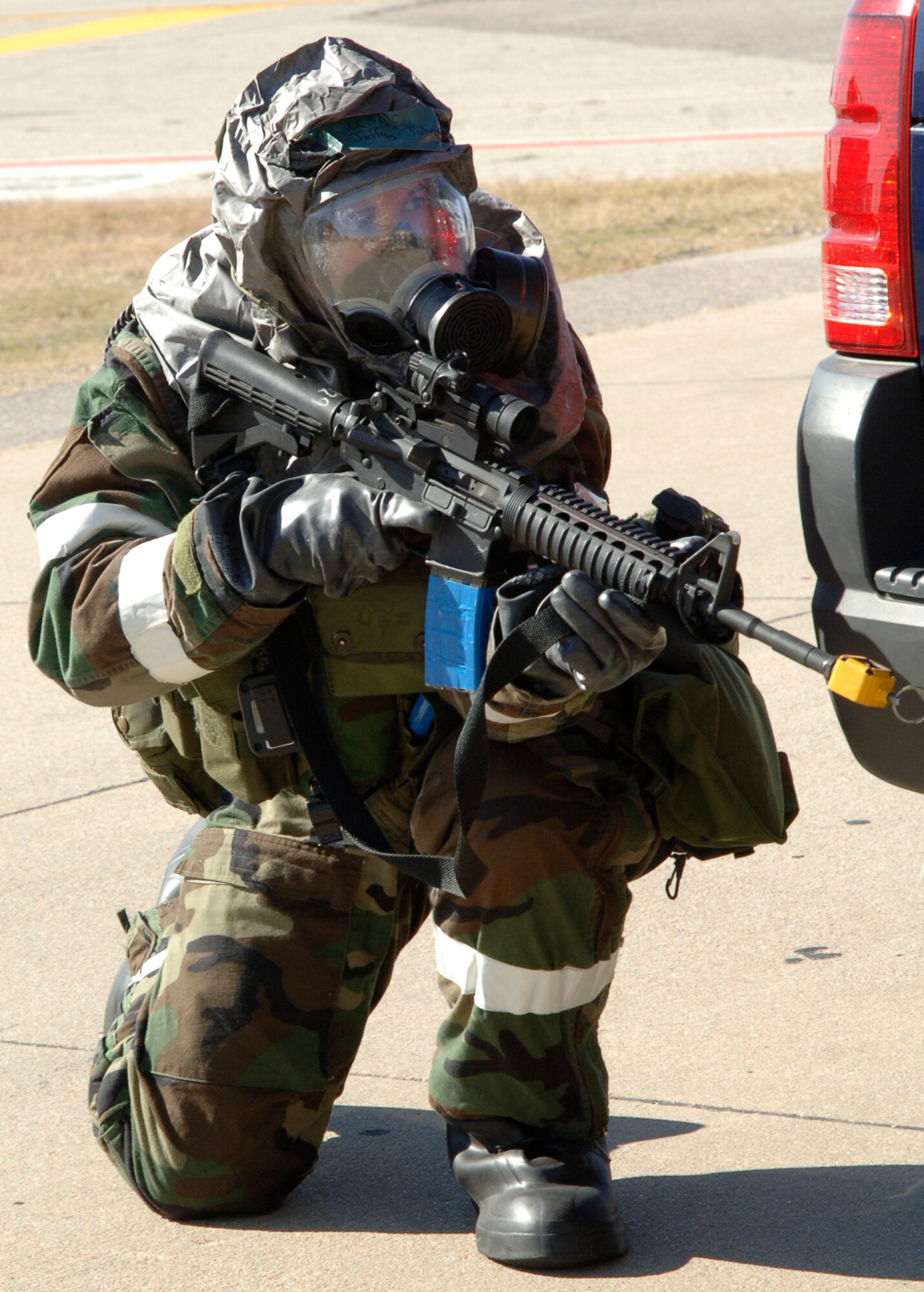 MCCONNELL AIR FORCE BASE, Kan. -- Senior Airman Jeffrey Johnson, 22nd Security Forces Squadron, fights off aggressors at the Alert Facility Bldg. 978 during the Injured Walker exercise Nov. 6. Injured Walker exercise is in preparation for the Operational Readiness Inspection which will be evaluated by the Inspector General.  (Photo by Airman 1st Class Roy Lynch)