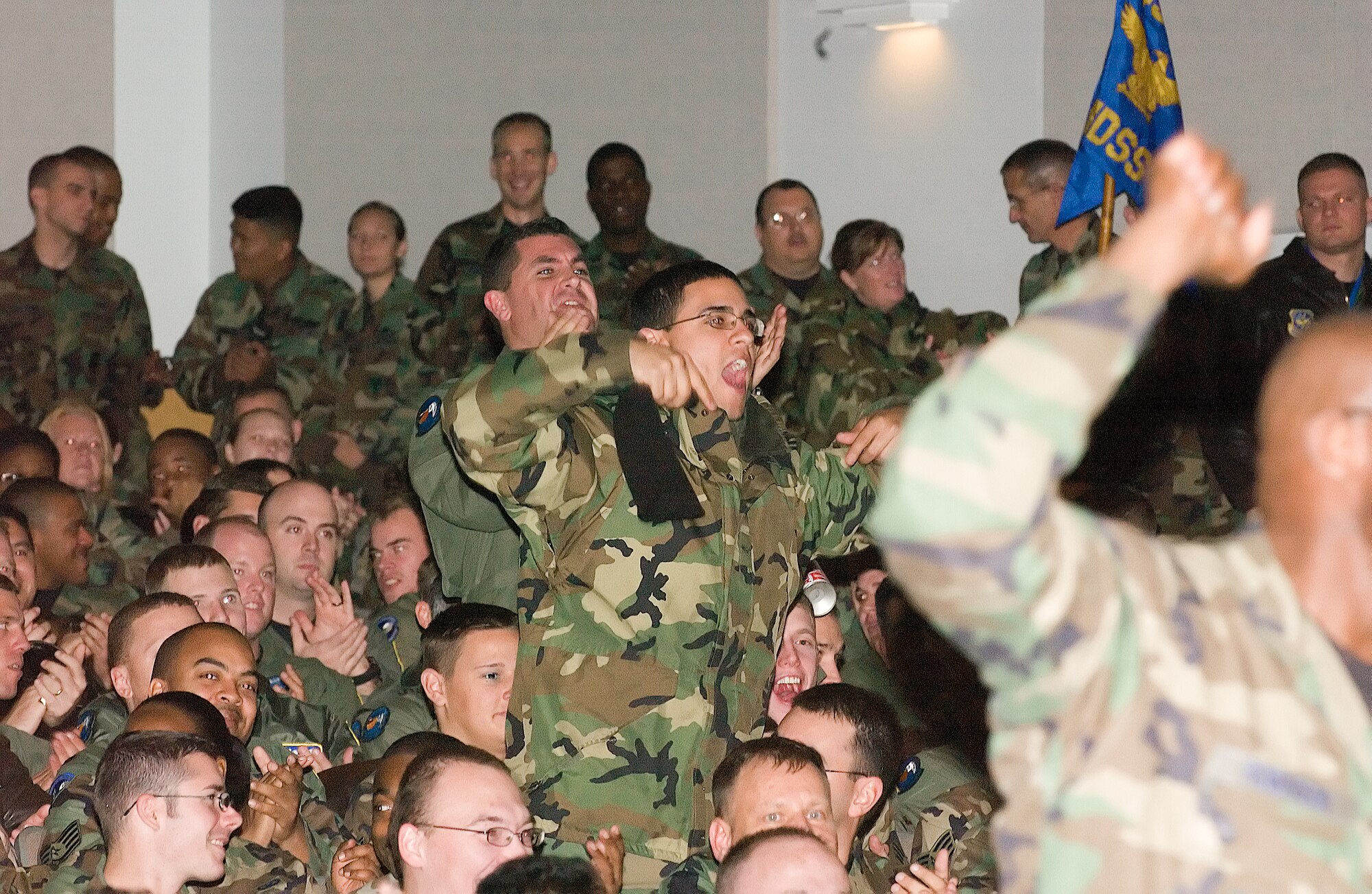Team Dover cheers and makes noise for their victory at a rally in the Base Theater Wednesday after Maj. Gen. James Hawkins, 18th Air Force commander, on behalf of Gen.  Arthur Lichte, Air Mobility Command commander, announced the base’s win of the AMC Commander in Chief’s Installation Excellence Award and presented Col. Steven Harrison, 436th Airlift Wing commander with a trophy and check for $100,000. (U.S. Air Force photo/Jason Minto)                              