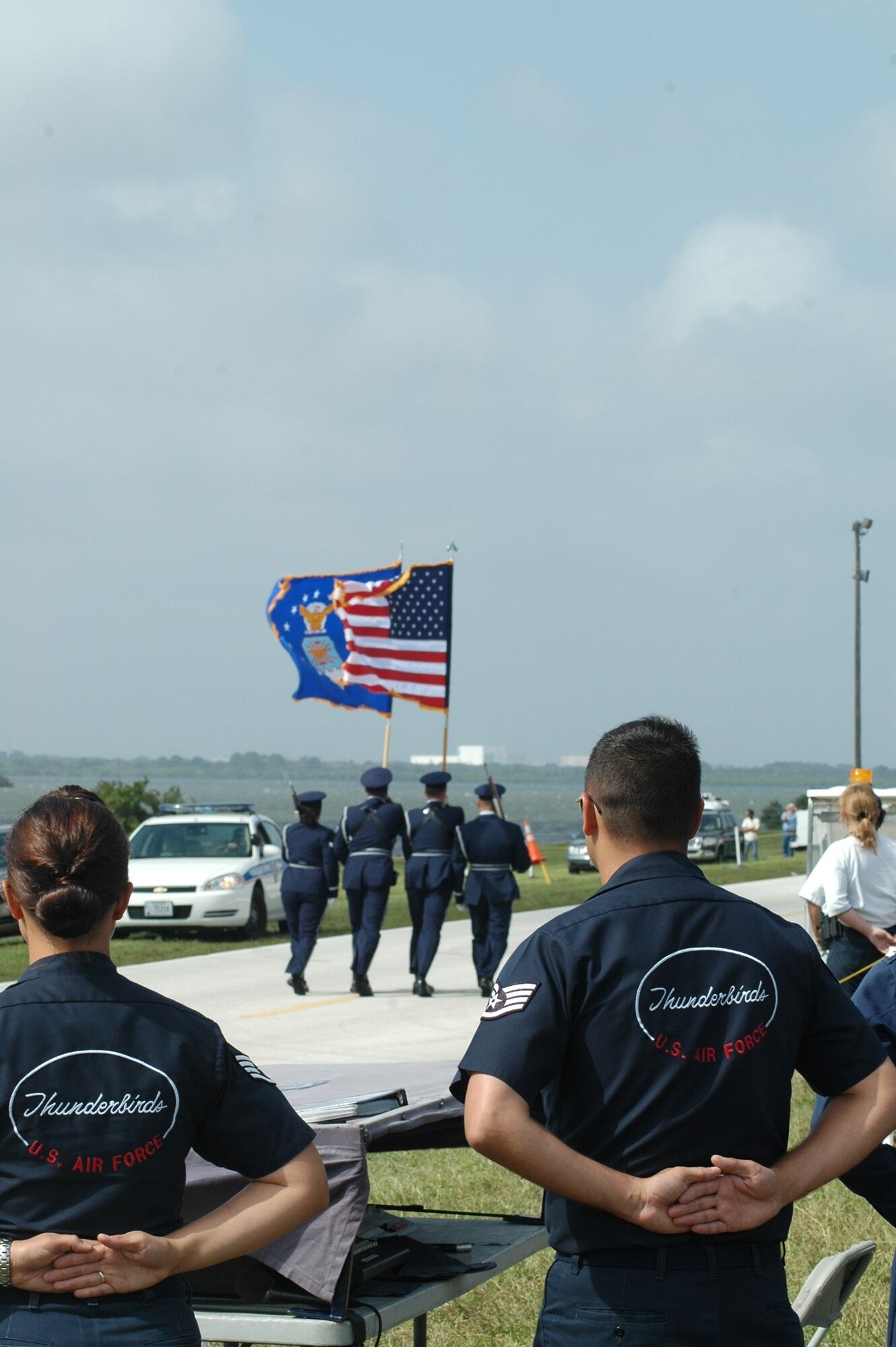 Members of the U.S. Air Force Thunderbirds stand at parade rest while the Patrick Honor Guard prepares to post the Colors during the World Space Expo held Nov. 1-4. (USAF photo by Maj. Greg Harland)