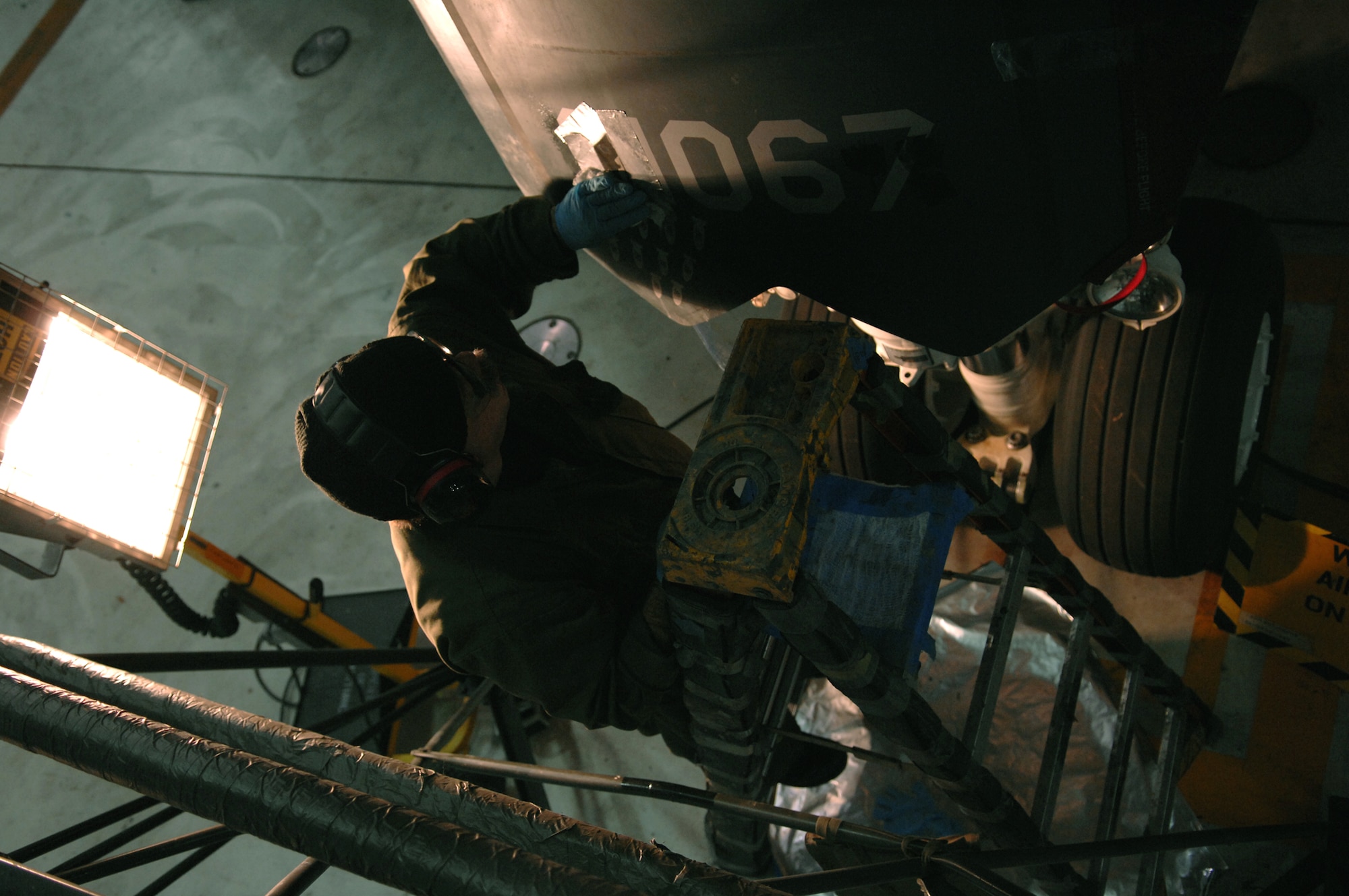 WHITEMAN AIR FORCE BASE, Mo. — Jeffrey Alvarado, 509th Maintenance Squadron, removes coating off a B-2 in preparation for a new coat of paint Nov. 6. The 509th Maintenance Group recently won the Air Combat Command's 2007 Clements McMullen Memorial Daedalian Weapon System Maintenance Trophy. (U.S. Air Force photo/Airman 1st Class Stephanie Clark)