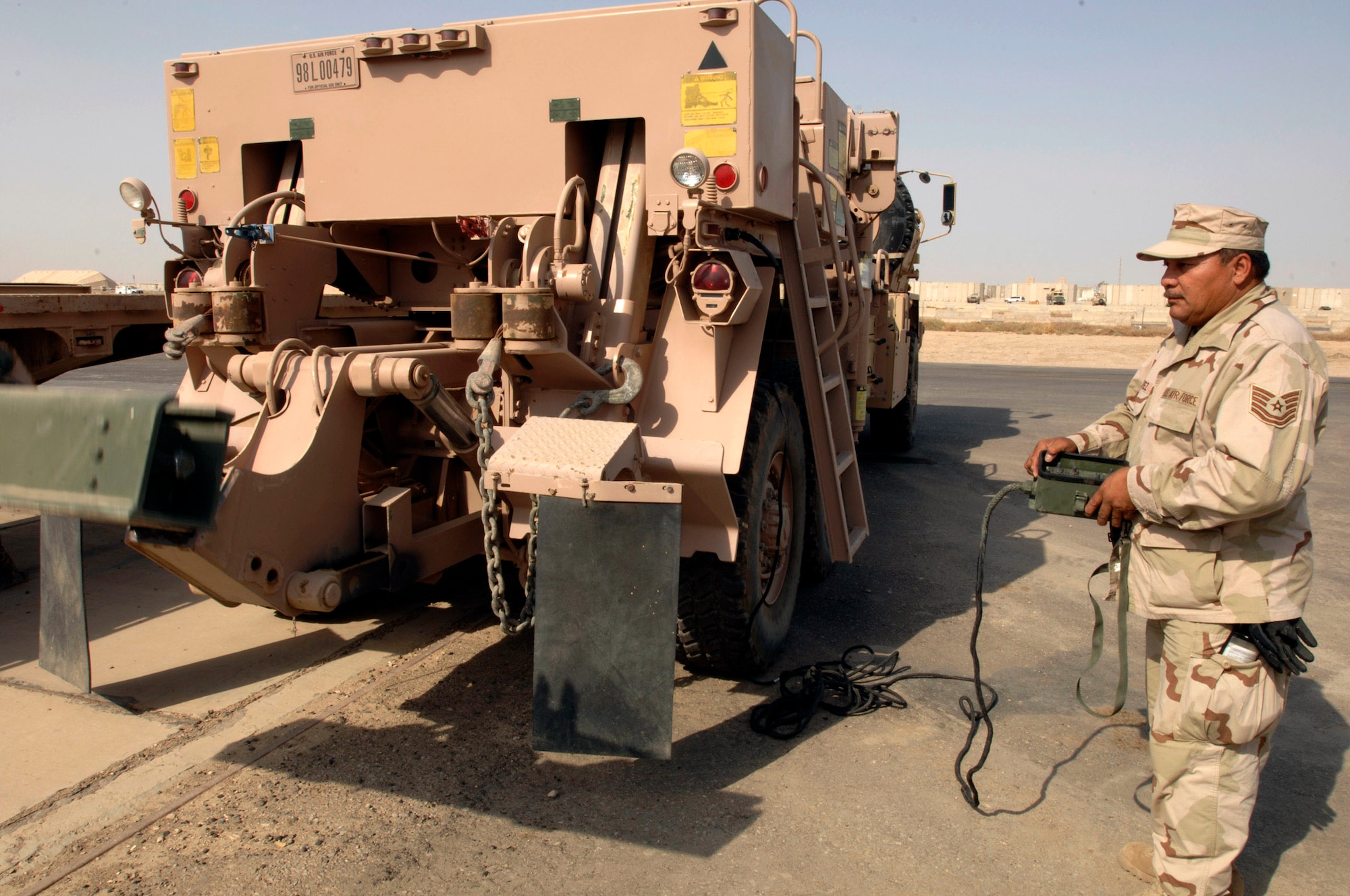Technical Sgt. Miguel Casarez checks the winch on a five-ton wrecker for proper operation Oct. 4 at Ali Base, Iraq. This vehicle is primairly used to tow or pull out stuck or broken down heavy vehicles. Sergeant Casarez is a member of theTexas Air National Guard's 149th Fighter Wing's Logistics Readiness Squadron deployed to the 407th Expeditionary Logistics Readiness Squadron. (U.S. Air Force photo/Airman 1st Class Jonathan Snyder) 