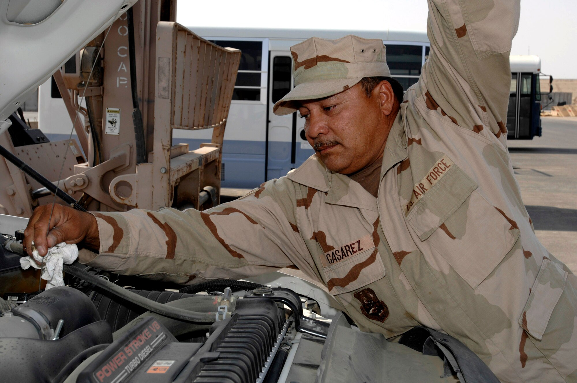 Technical Sgt. Miguel Casarez checks the oil of a government-owned vehicle Oct. 4 at Ali Base, Iraq. Sergeant Casarez is a member of theTexas Air National Guard's 149th Fighter Wing's Logistics Readiness Squadron deployed to the 407th Expeditionary Logistics Readiness Squadron. (U.S. Air Force photo/Airman 1st Class Jonathan Snyder) 