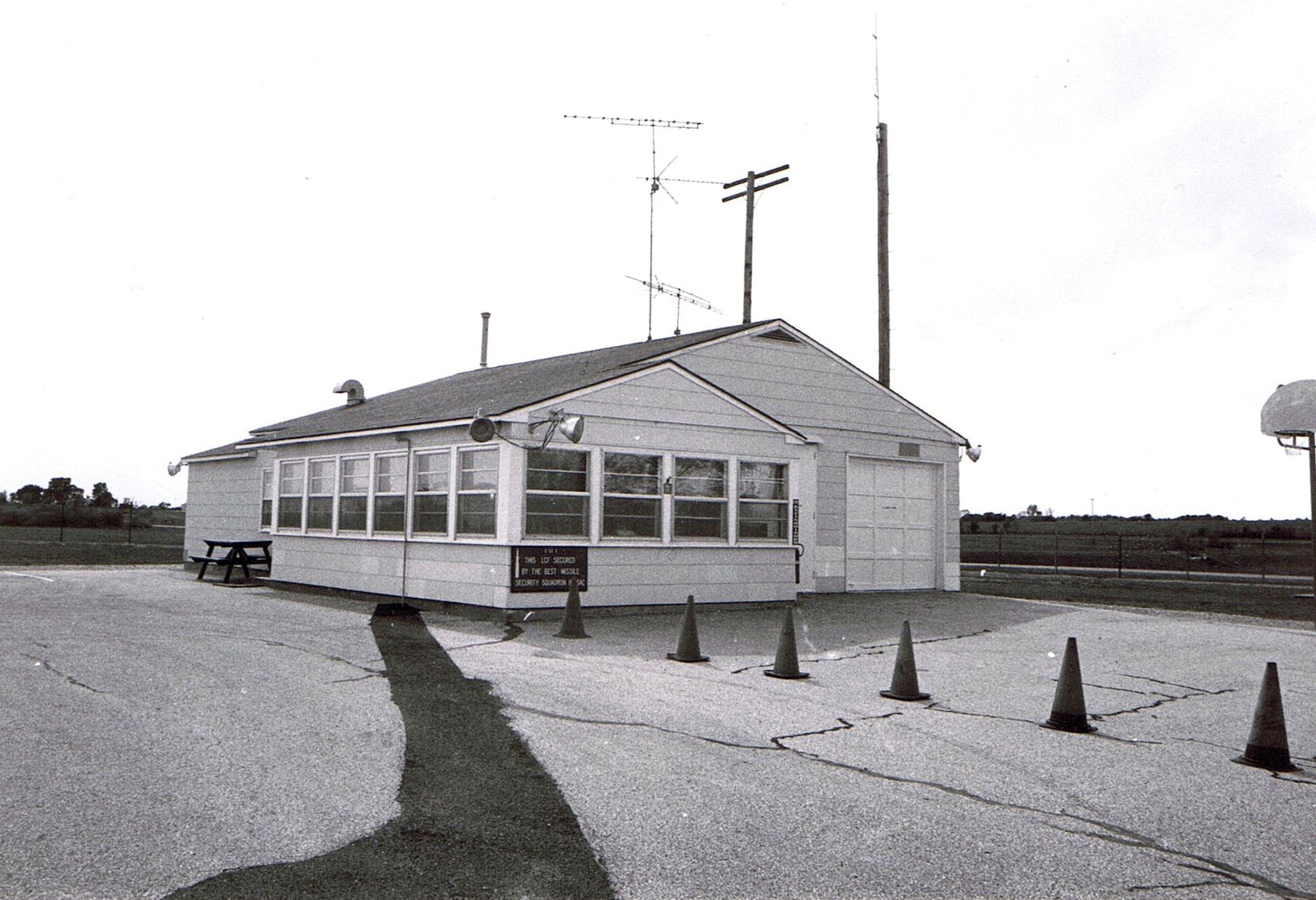 Launch control facility sites like this one were designed to function even after the initial exchanges of a nuclear war. Self-contained, the underground portion housed batteries, a power generator, telephone switches for the underground cable system, and air regeneration equipment. Redundancies in the system meant that even a damaged LCF would have the minimal capability to perform its mission. The facility was manned by 10 people with two assigned as crew downstairs. (U.S. Air Force photo)