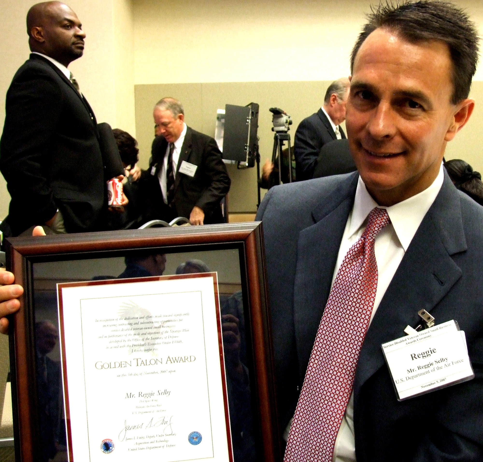 Talon Award recipient Reggie E. Selby is a small business specialist at Peterson Air Force Base, Colo.  Enlisting small companies owned by service-disabled veterans to work with the Defense Department is good business and the right thing to do, Selby said at the first Service-Disabled Veteran Owned Small Business Awards ceremony held at the Pentagon on Nov. 5. (DOD photo/Gerry J. Gilmore)