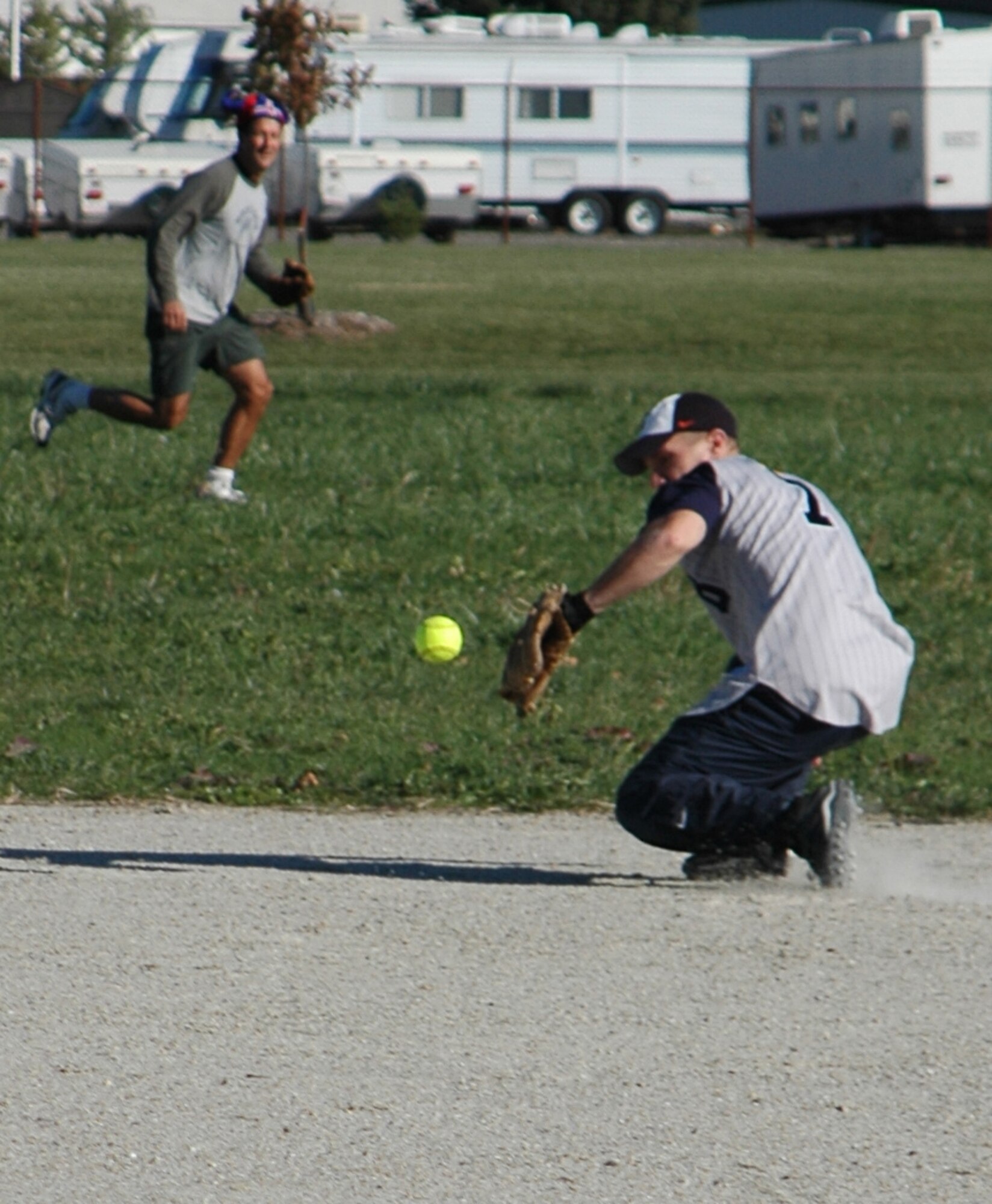 GRISSOM AIR RESERVE BASE, Ind., -- Dan Keeney, a shortstop for the 74th Air Refueling Squadron Fighting Red Tags, makes a back handed stab at a ball laced up the middle. The Fighting Red Tags defeated their rival refuelers from the 72nd Air Refueling Squadron 18-9 in the inaugural Jovanovich Cup. The cup is named after Lt. Col. George Jovanovich, a member of the unit who died in 2006. (U.S. Air Force photo/Tech. Sgt. Doug Hays)