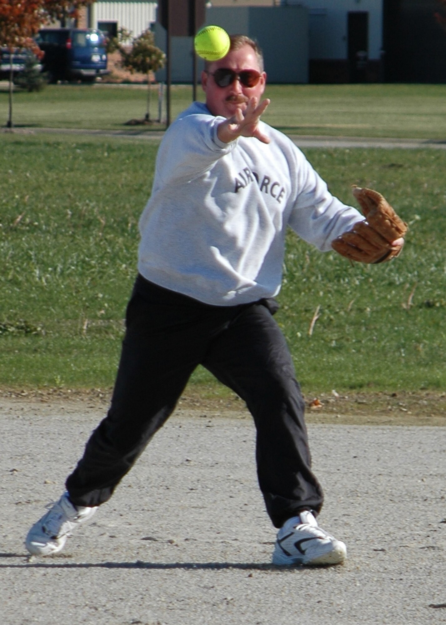 GRISSOM AIR RESERVE BASE, Ind., -- Doug Gullion, second basemen for the 74th Air Refueling Squadron Fighting Red Tags, zips a throw to first base to force out a rival refueler from the 72nd ARS during inaugural Jovanovich Cup action. The Fighting Red Tags rallied to win 18-9. The cup was named after Lt. Col. George Jovanovich, who died in 2006. (U.S. Air Force photo/Tech. Sgt. Doug Hays)