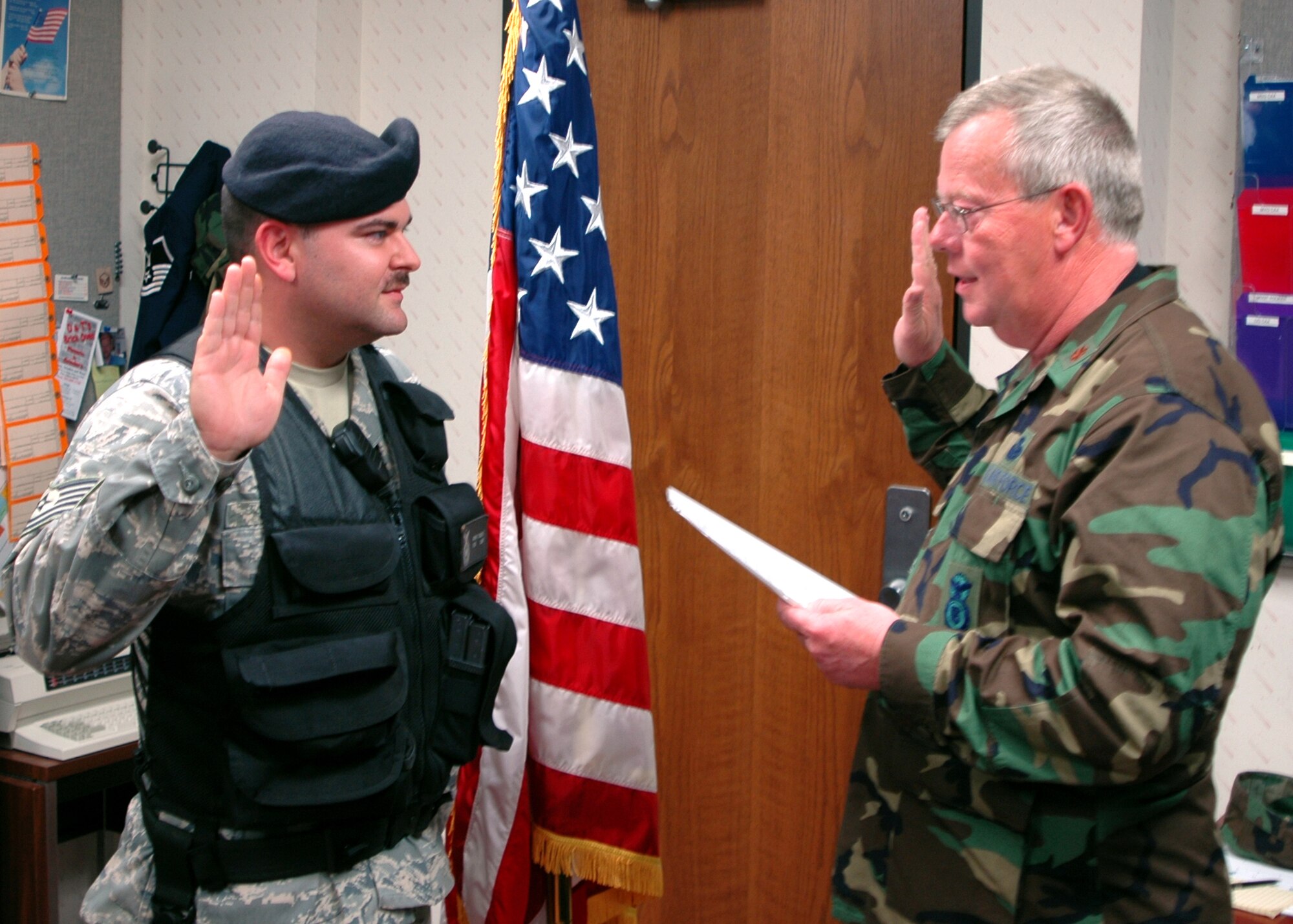 GRISSOM AIR RESERVE BASE, Ind., -- Tech. Sgt. Adam Soultz (left), a member of the 434th Security Forces Squadron, becomes the first career Active Guard Reserve to re-enlist at Grissom. Maj. Randal Stivers, 434th SFS commander was the officer in charge. Sergeant Soultz said, "It has been and honor and a privilege to serve here." (U.S. Air Force photo/Senior Airman Carl Berry)