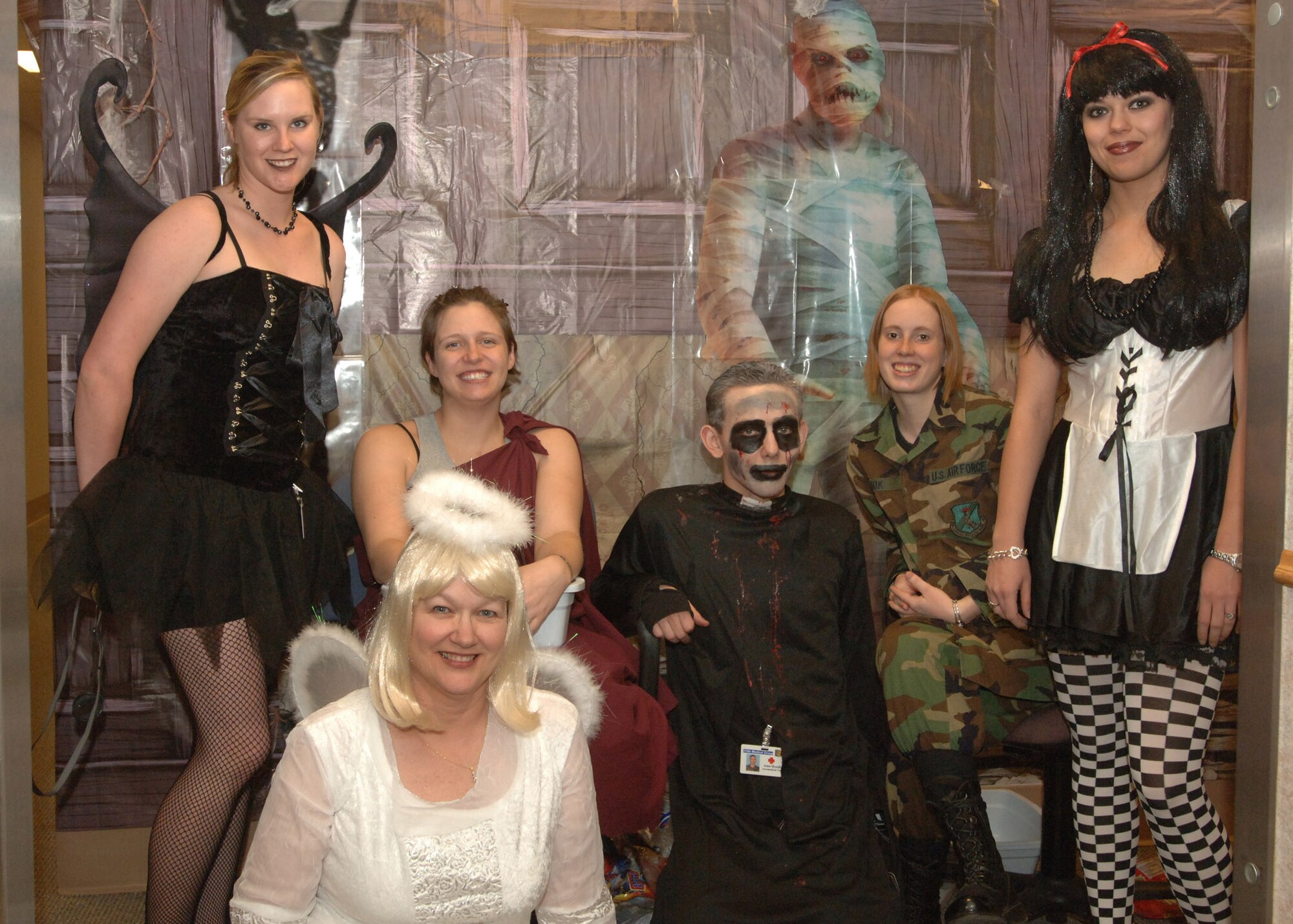 Medical personnel pose for the Halloween 319th Medical Group trick-or-treat here Oct. 31. The Med Group takes on this activity annually for the base population. (U.S. Air Force photo/Airman 1st Class Daniel Hernholm)