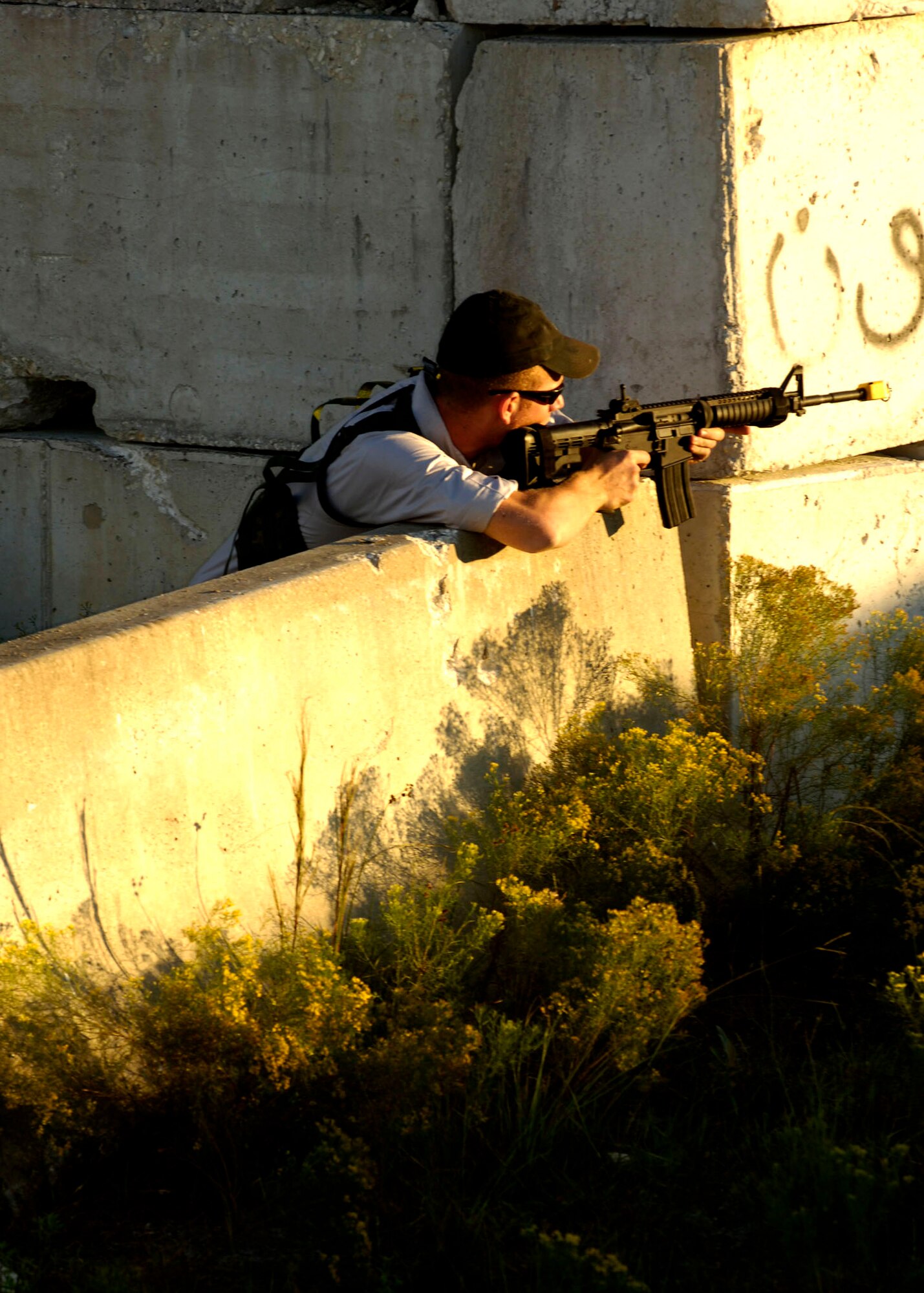 Airman Josh Lacki prepares to fire at "enemy" troops during Atlantic Strike VI Nov. 6 at Avon Park, Fla. Airman Lacki is a tactical air control party member from the 11th Air Support Operations Squadron at Fort Hood, Texas. He is part of the opposition forces during the exercise to challenge joint terminal attack controllers working with Army platoons to use airpower in urban close-air-support operations. The exercise is scheduled to last through Nov. 9. (U.S. Air Force photo/Airman 1st Class Stephenie Wade) 
