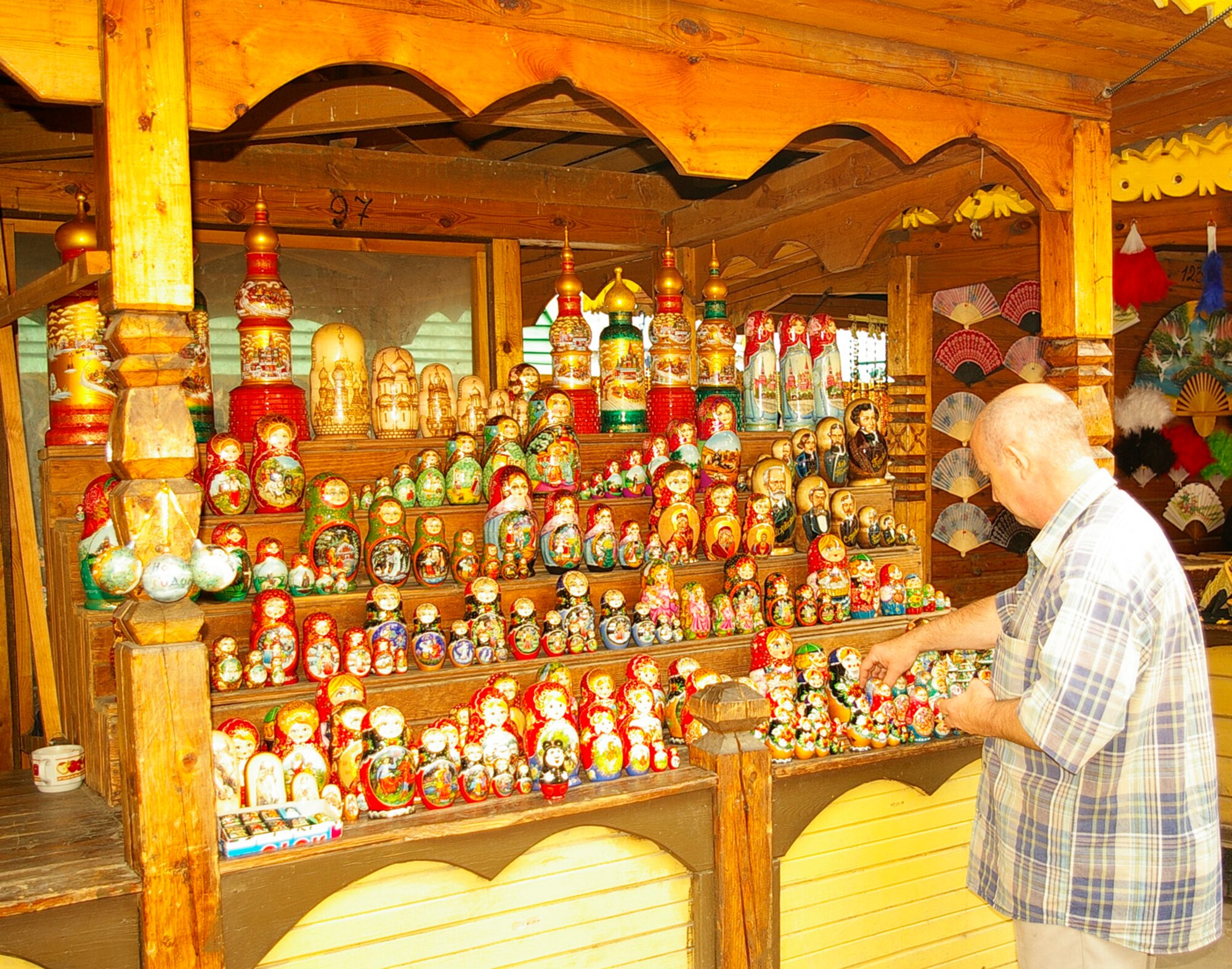 A vendor at Izmaylovo Market, in Moscow, sets out an array of Matryoshka dolls on his stall. The market houses a huge range of stalls, selling items ranging from all kinds of Matryoshka dolls, both traditional and not, wooden chess sets, Russian hats and Soviet memoriabilia, to shawls and clothing. Entry to the market costs less than 20 rubles, which is less than $1. (U.S. Air Force photo by Karen Abeyasekere)