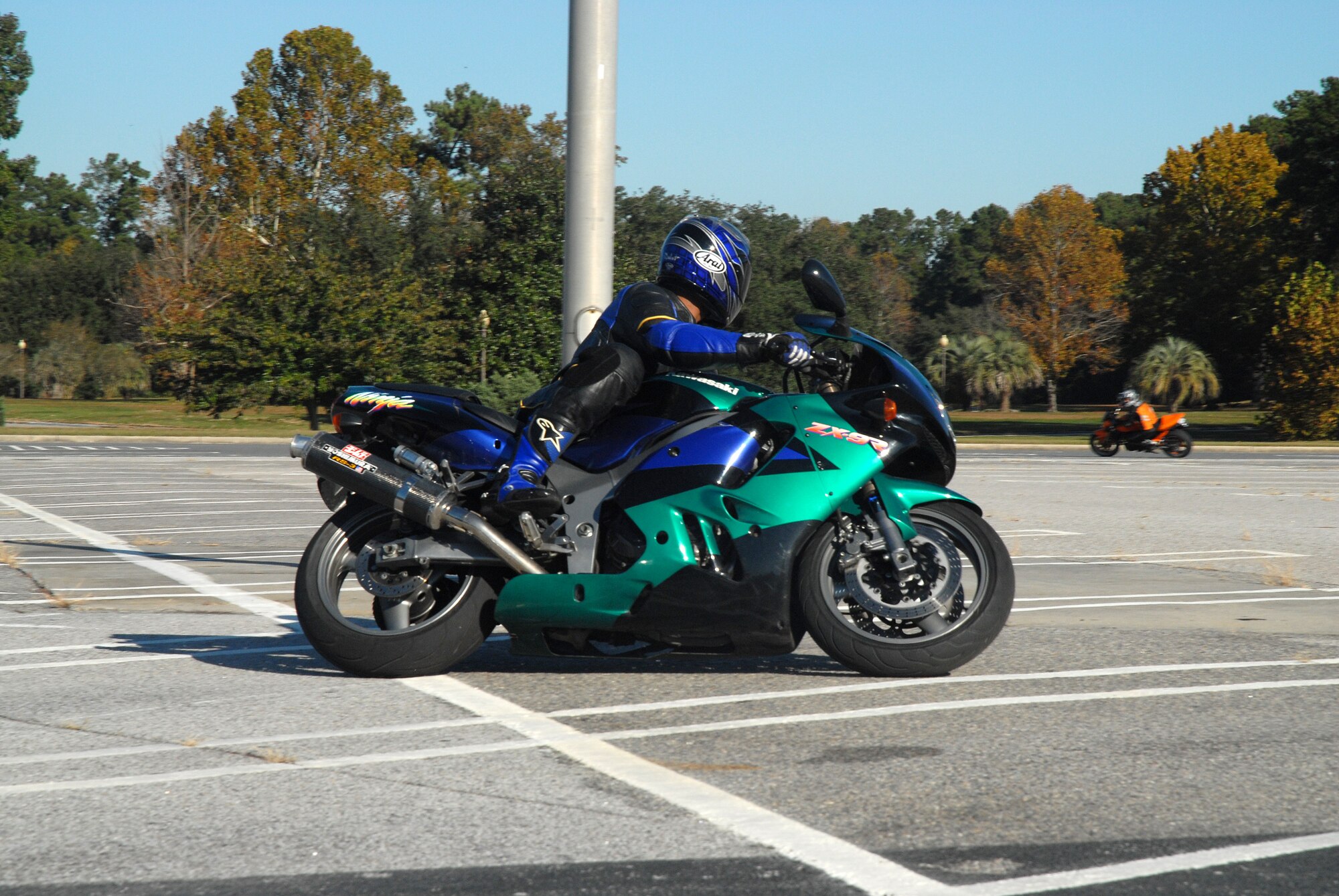 Tech Sgt. Anthony Mitchell, 437th Airlift Wing, warms up his tires during the sport bike riders course Nov. 9 in the Base Exchange parking lot on Charleston AFB. 