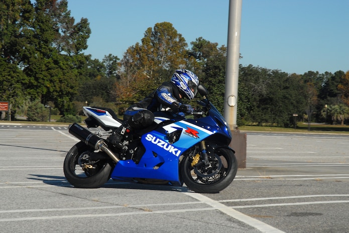 1st Lt. Nick Rodriguez, 14th Airlift Squadron, completes a sharp turn during the sport bike riders course Nov. 9 in the Base Exchange parking lot on Charleston AFB.