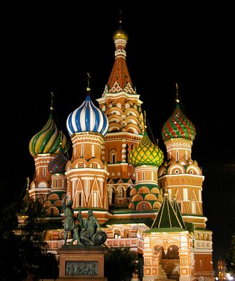 The multi-colored domes of St. Basil's Cathedral, standing opposite Resurrection Gate, are even more beautiful at night than during the day. The cathedral was commissioned by Ivan the Terrible to celebrate the capture of the Mongol stronghold of Kazan in 1552. The cathedral was completed in 1561 and, according to a Moscow guidebook, was reportedly designed by architect Postnik Yakovlev. (U.S. Air Force photo by Karen Abeyasekere)