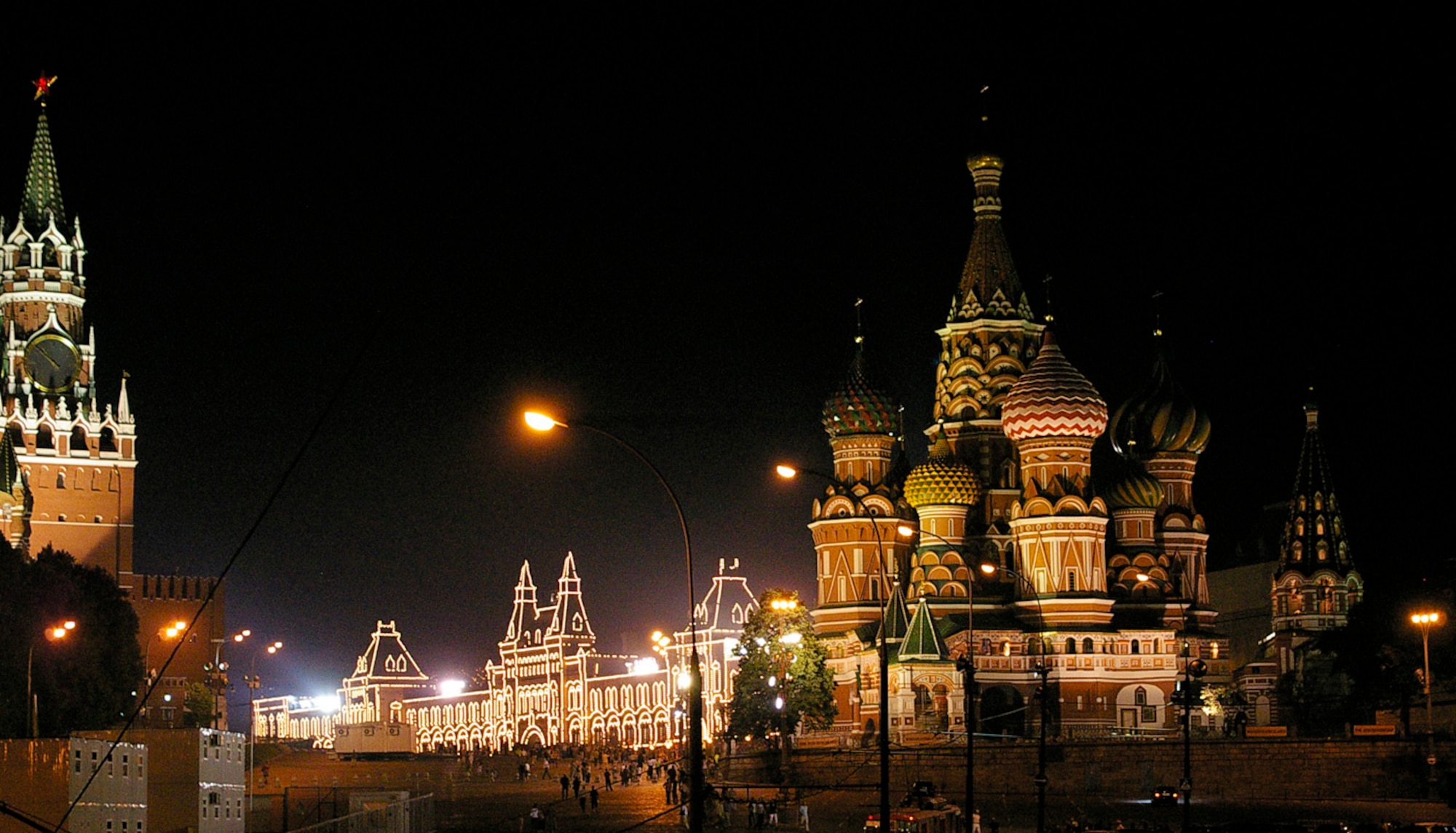 Looking into Red Square from the rear of St. Basil's Cathedral, shows Gosudarstvennyy Universalnyy Magazine (known as GUM), Russia's largest department store, which is a mass of twinkling lights at night. (U.S. Air Force photo by Karen Abeyasekere)