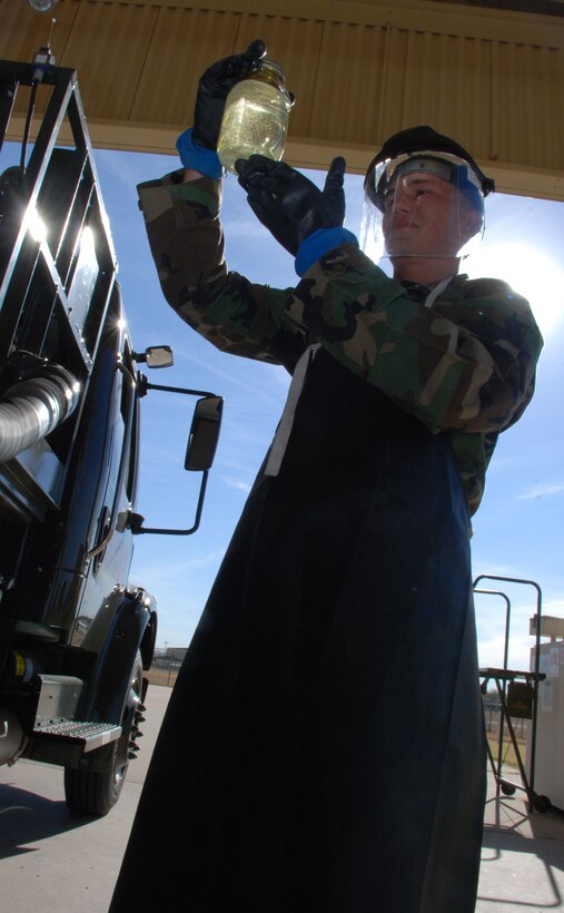 Airman Basic Chad Clark, an Airman in Training in the fuels training course, examines a fuel sample Nov. 6. Airman 1st Class Hazen Sanders, recently a student in the same course and currently assigned to the 435th Logistics Readiness Squadron, Ramstein Air Force Base, Germany, recently pumped 3 million gallons of fuel in one month, setting a new Air Force record and inspiring Airmen back at Sheppard. (U.S. Air Force photo/Airman 1st Class Jacob Corbin)