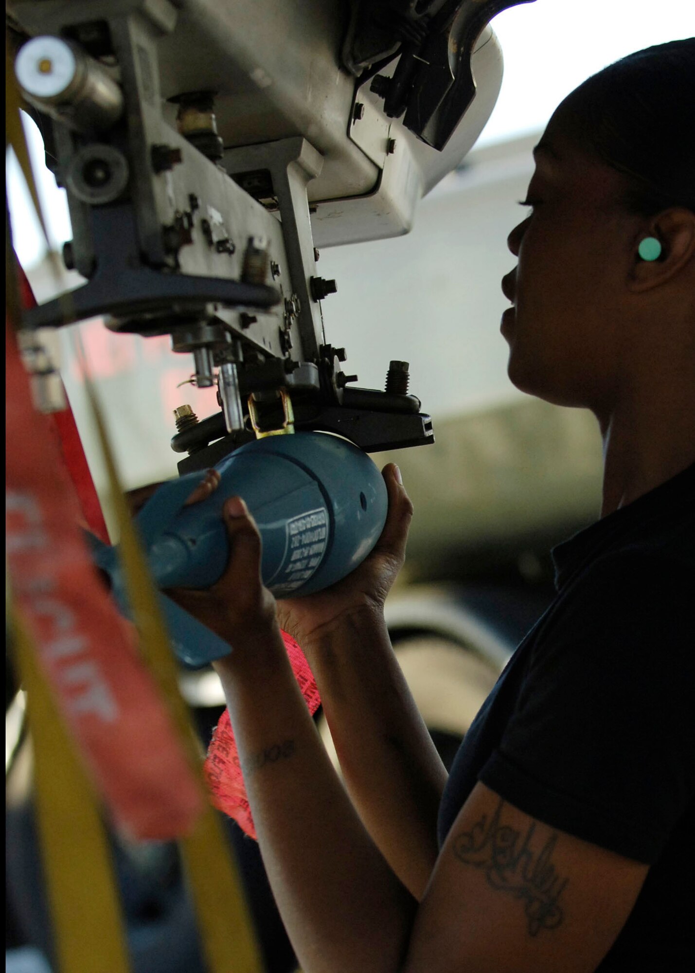 Senior Airman Ashley Hunter; a weapons load crew member from Spangdahlem AFB Germany; loads and secures a BDU-33 practice munition onto an A-10 Thunderbolt II on MacDill AFB; Fla. Deployed Unit Complex. The bomblets are bound for the Avon Park Air Ground Training Complex as part of Atlantic Strike VI; a U.S. Central Command Air Forces-sponsored exercise aimed at improving the coordination between Joint Terminal Attack Controllers and aircraft during urban CAS scenarios. (U.S. Air Force Photo By Airman 1st Class Stephenie Wade)