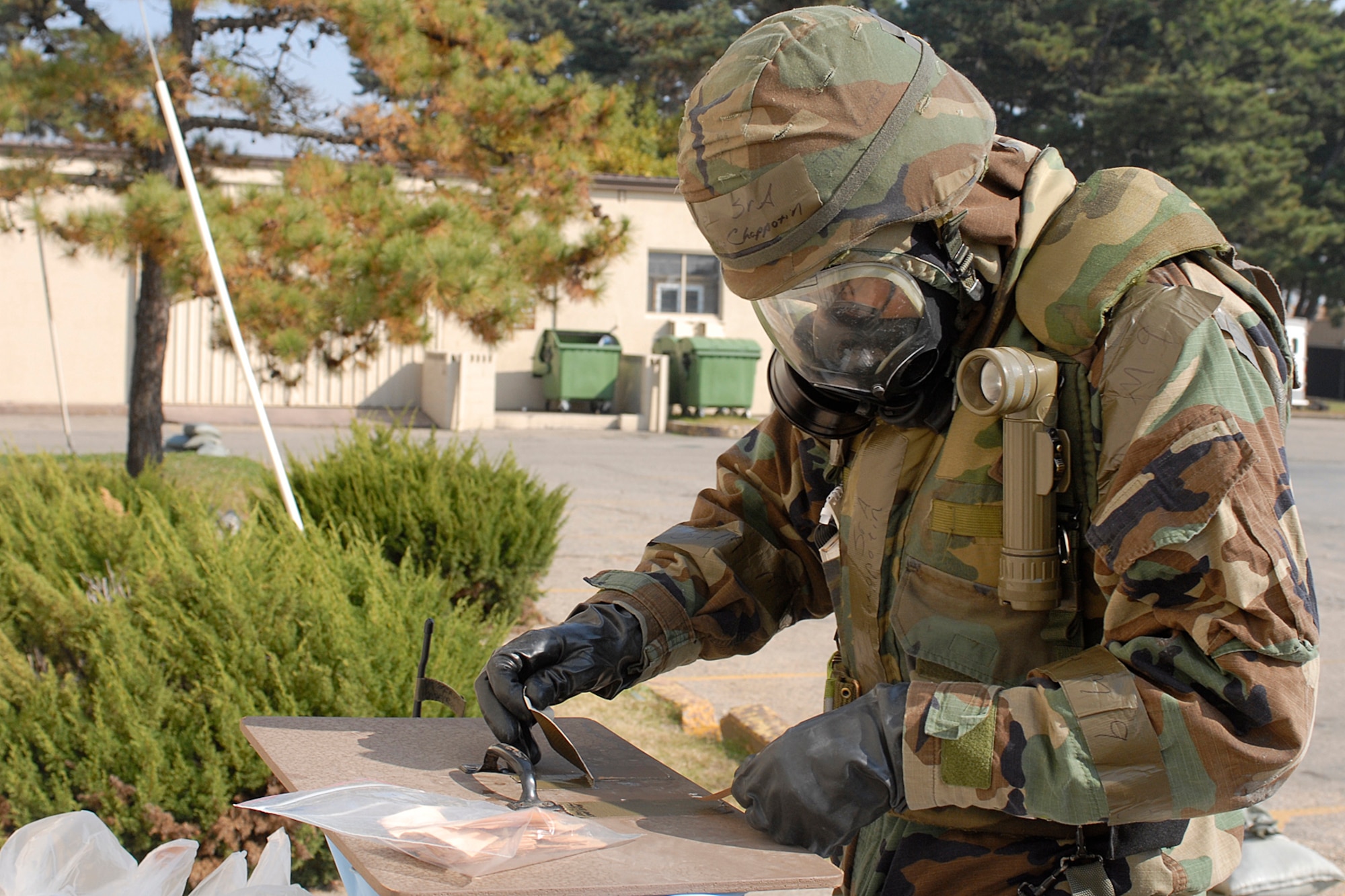 KUNSAN AIR BASE, South Korea --  Senior Airman Argelio Chappotin, 8th Civil Engineer Squadron, checks M-8 paper during a general release after a simulated missile attack here Nov. 8.  The Peninsula Operational Readiness exercise is conducted to ensure members of the Wolf Pack remain ready to execute its mission of "Defend the Base, Accept Follow on Forces and Take the Fight North." (U.S. Air Force photo/Senior Airman Giang Nguyen)