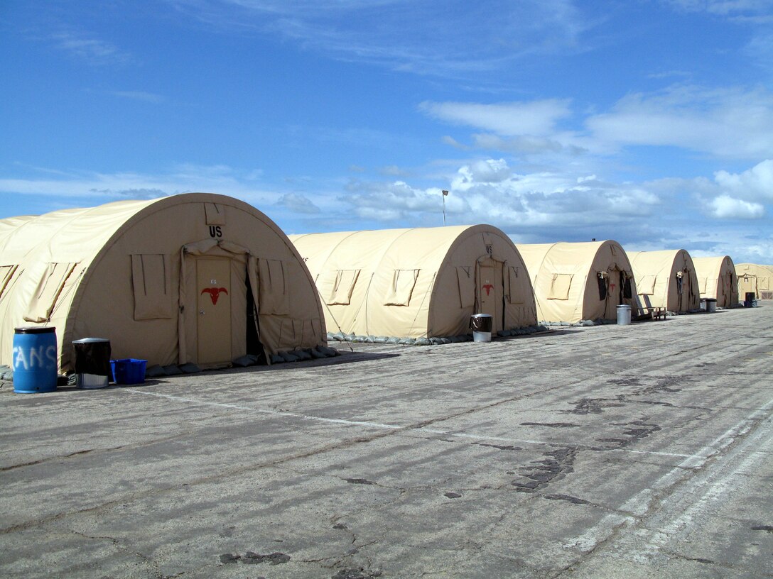 Rows of modular tents lined up at Camp Justice can be quickly disassembled and moved elsewhere when they’re no longer needed at Guantanamo Bay, Cuba, to support the military commission process. Photo by Donna Miles