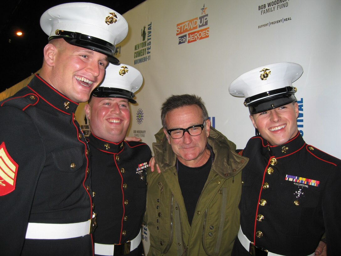Marine Sgt. James Bane, Marine Lance Cpl. Daniel Hurst, comedian Robin Williams and Marine Lance Cpl. James Scott MacKenzie pose for photos Nov. 7, 2007, before "Stand Up for Heroes," a comedy and music event in New York City arranged by the Bob Woodruff Family Fund to raise money for servicemembers injured in Iraq and Afghanistan. Photo by John J. Kruzel

