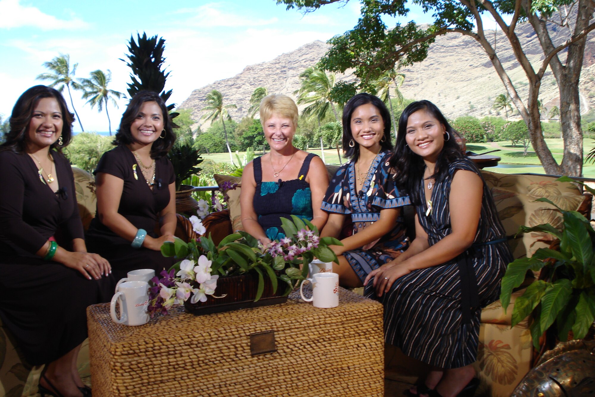 Center, Mrs. Judy Maharrey, spouse of Lt. Col. Dave Maharrey, 15th Civil Engineer Squadron commander, sits with the Baraquios sisters at  Makaha Resort and Golf Course, before an interview for an upcoming Veterans Day/Military Appreciation Special show. The special airs, Nov. 12 at 8 p.m. on OC16, plus multiple times throughout that week. The show also features the Thunderbirds, Tech. Sgt. Daniel Baduria, 154th Maintenance Squadron, Hawaii Air National Guard, who was the opening act for “Tops In Blue” during Air Force Week, Hawaii.  The show will also be posted on the web at  http://www.livinglocal.tv/, after it is broadcast. Photo by Master Sgt. Robert Burgess