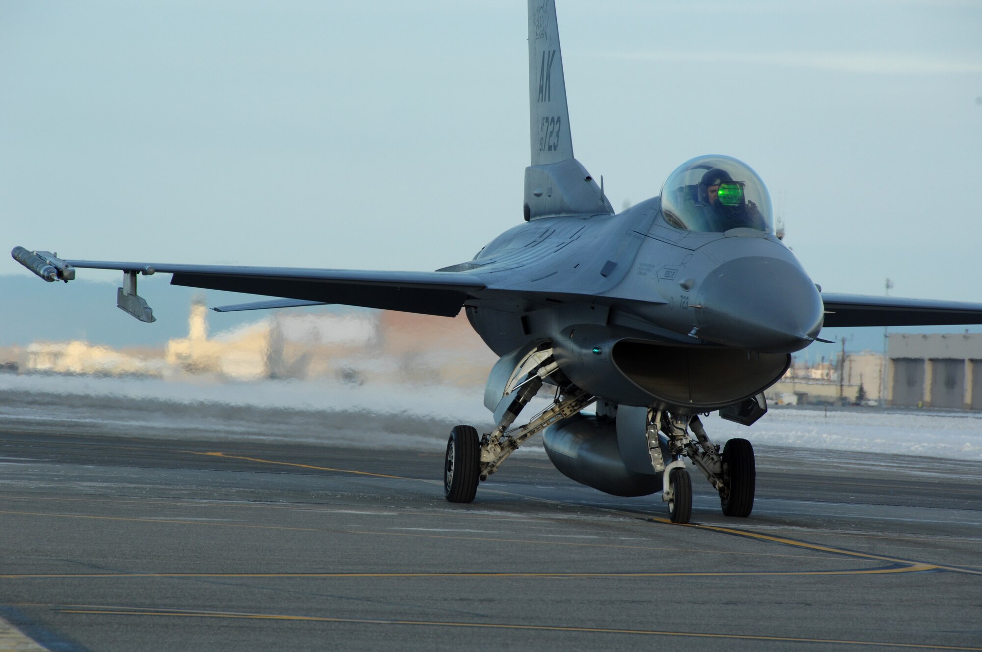 EIELSON AIR FORCE BASE, Alaska -- An F-16 Fighting Falcon prepares to take off the Eielson flightline Nov. 7, 2007. The Future Weapons crew is visiting Eielson to document arctic survival conducted by Det.1, 66th Training Squadron, otherwise known as "Cool School," and the Joint Precision Airdrop System being used under arctic conditions. (U.S. Air Force photo by Airman 1st Class Christopher Griffin)