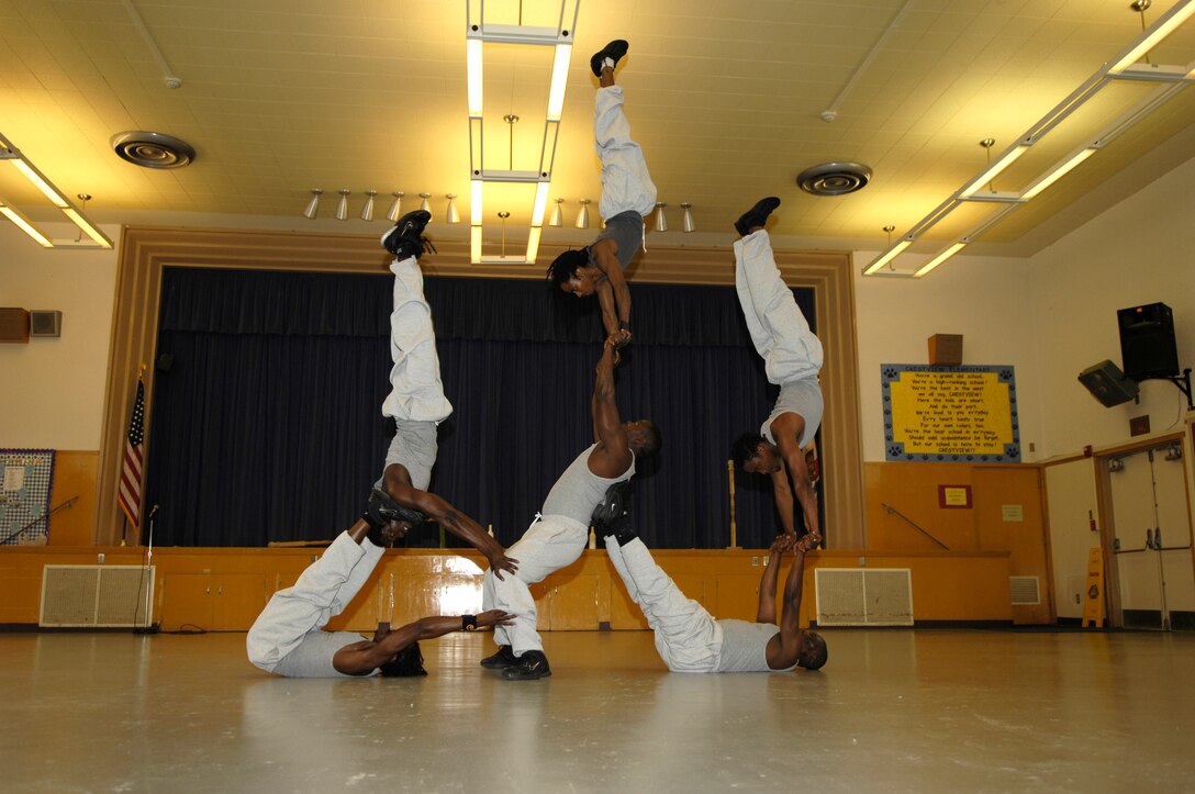VANDENBERG AIR FORCE BASE, Calif. -- Members of Famous Africa Acrobats LLC. use leverage and strength to perform stunning feats of balance at Crestview Elementary on Nov. 8.  Performances included the limbo, jump roping, summersaults, and human pyramids.  (U.S. Air Force photo/Airman 1st Class Cole Presley)