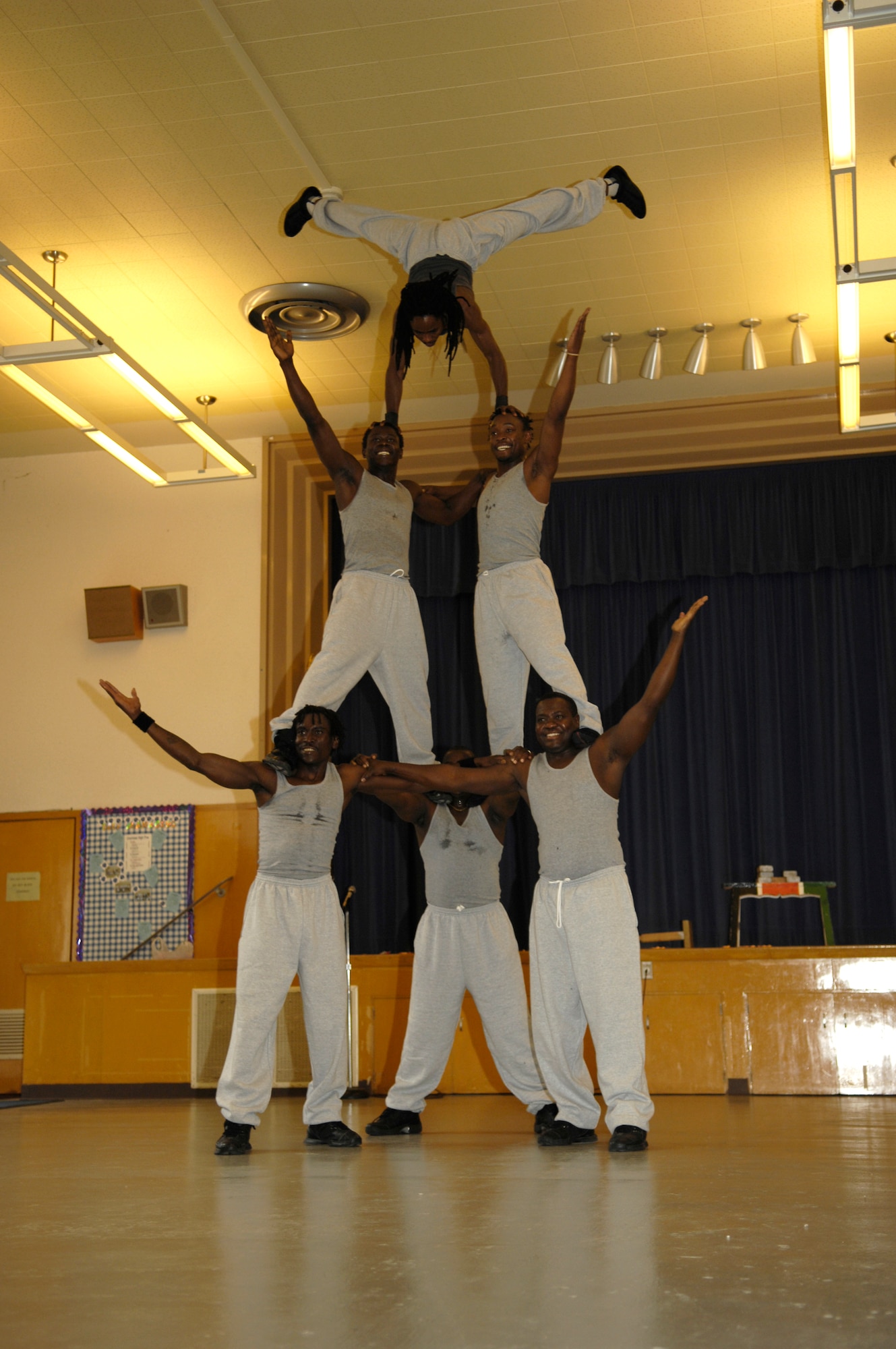 VANDENBERG AIR FORCE BASE, Calif. -- Members of Famous Africa Acrobats LLC. make a human pyramid during a show for kids at Crestview Elementary on Nov. 8.  Performances included the limbo, jump roping, summersaults, and human pyramids.  (U.S. Air Force photo/Airman 1st Class Cole Presley)
