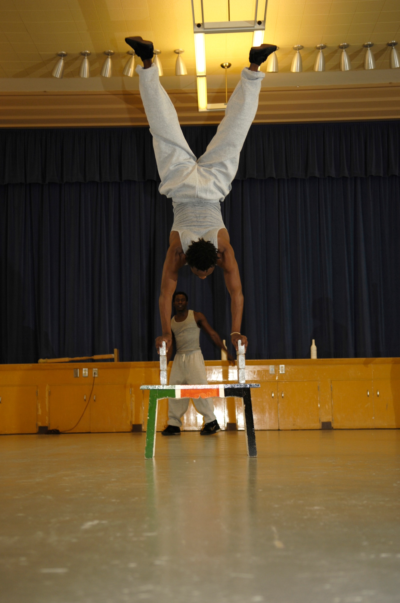 VANDENBERG AIR FORCE BASE, Calif. -- Amos Mwadzoya wows an elementar school audience with his balancing ablility during a show at Crestview Elementary on Nov. 8. Famous Africa Acrobats LLC., travels nationwide and their performances include the limbo, jump roping, summersaults, and human pyramids. (U.S. Air Force photo/Airman 1st Class Cole Presley)