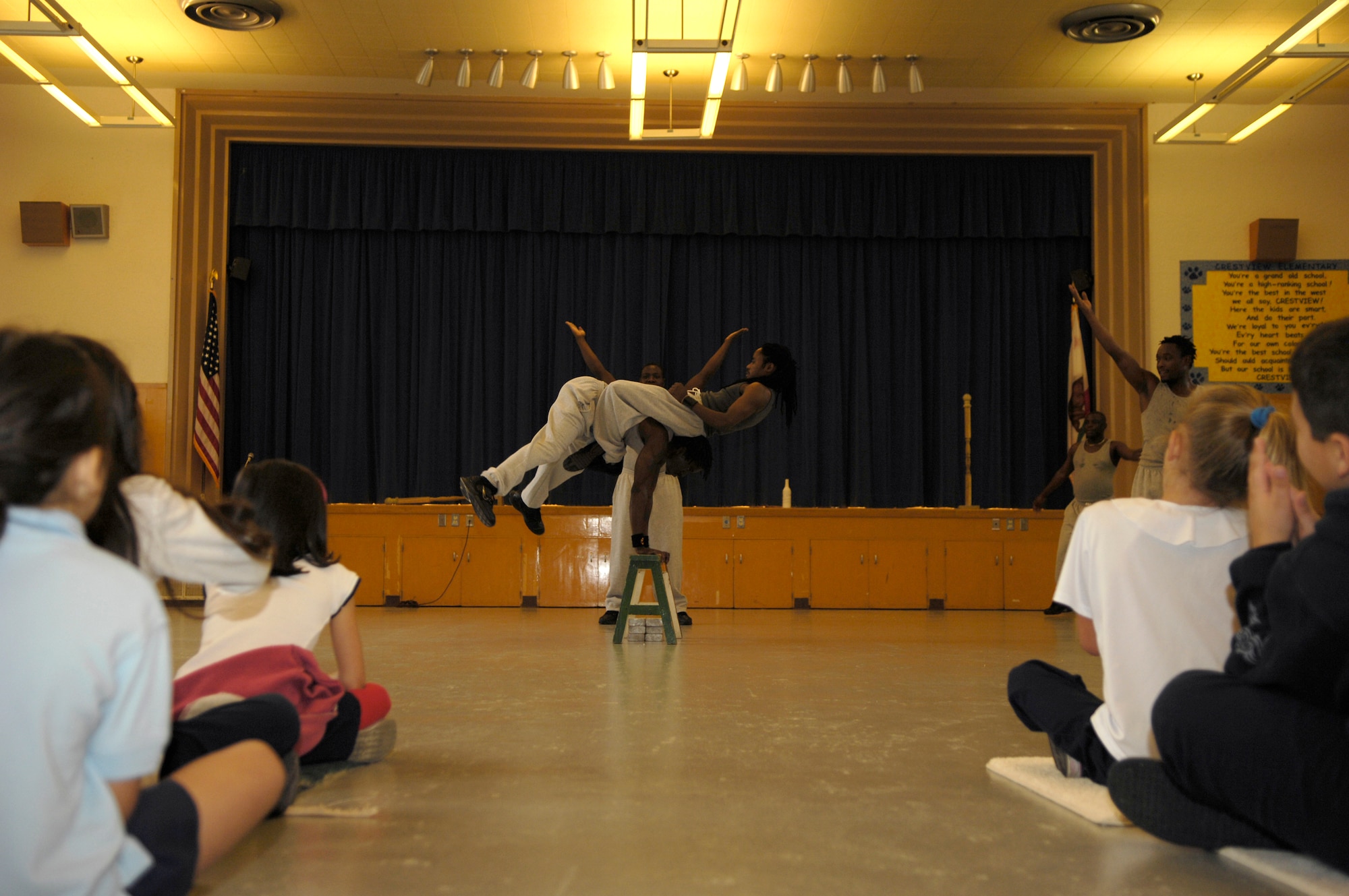 VANDENBERG AIR FORCE BASE, Calif. -- Members of Famous Africa Acrobats LLC., perform an acrobatic balancing act during a show for kids at Crestview Elementary Nov. 8.  The team travels nationwide, and their performances include the limbo, jump roping, summersaults, and human pyramids. (U.S. Air Force photo/Airman 1st Class Cole Presley)