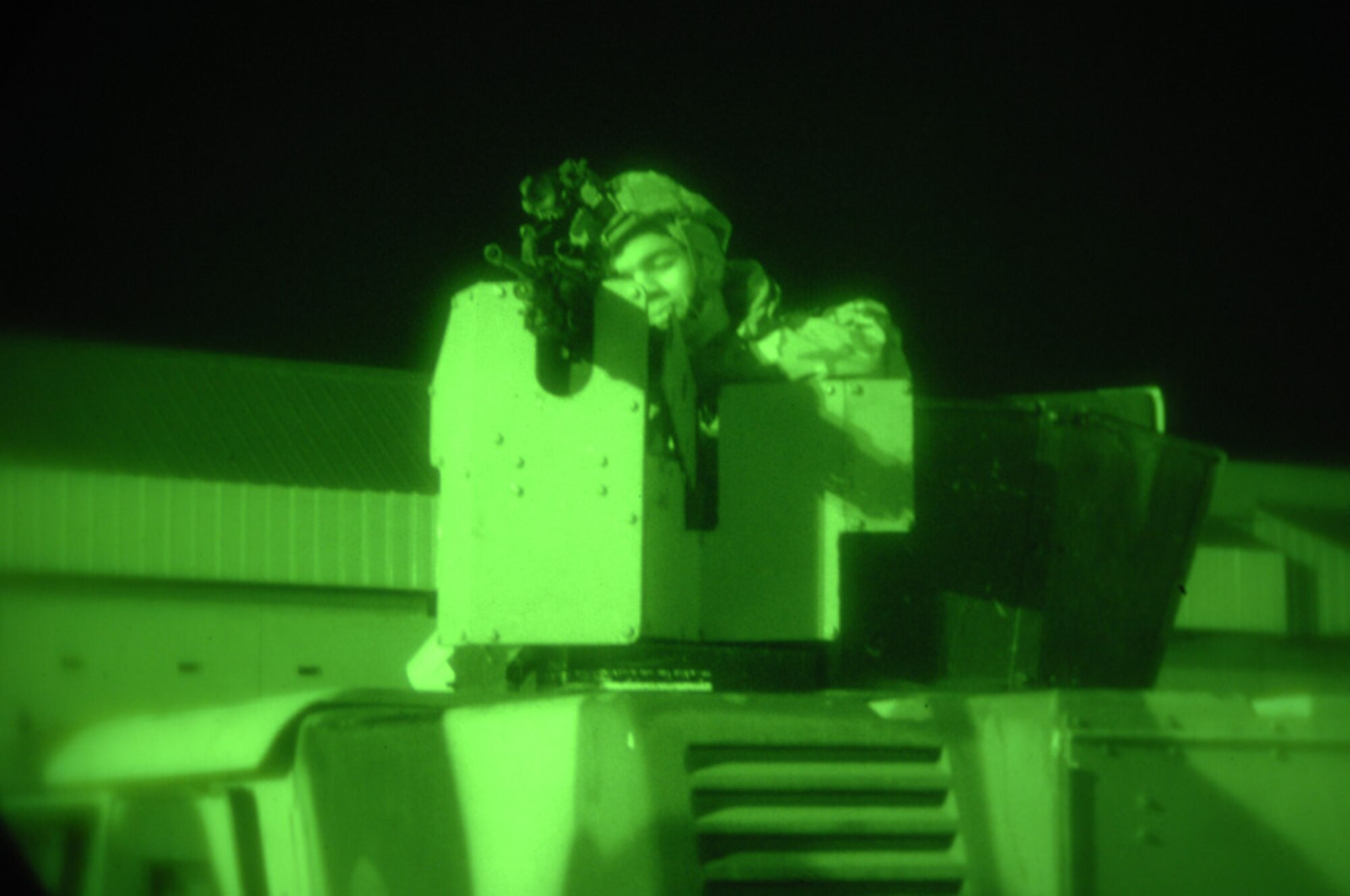 MINOT AIR FORCE BASE, N.D. -- Airman 1st Class Monty Elliot, 5th Security Forces Squadron, takes aim and simulates firing at members of an opposing force attempting to breach a secure facility, during a base exercise here, Nov. 8. (Photo by Airman 1st Class Cassandra Jones)