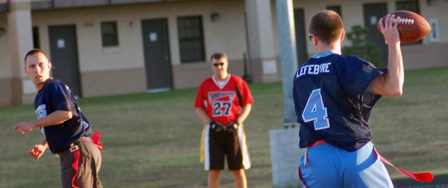 52nd Training Squadron quarterback Ethan Lefebvre look to deliver a pass to a wide open Rich Ranachowski during the third quarter of a game against the 72nd Operations Support Squadron Thunderhawks Oct. 31. The 552nd TRS won 19-7. (Air Force photo by John E. Banks)