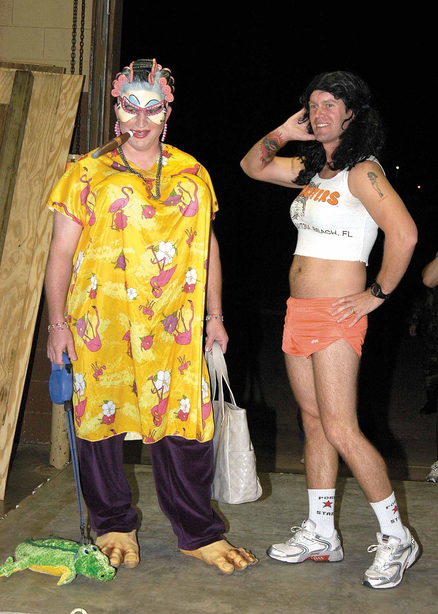 Posing for pictures, applause and a lot of laughter, winners of the 3rd Herd costume contest enjoy the spotlight before the monthly Stampede, a group-wide fitness activity. Staff Sgt. Jerry Harding, left, and Master Sgt. Michael Mujwid earned a day off for their win. (Air Force photo by Margo Wright)
