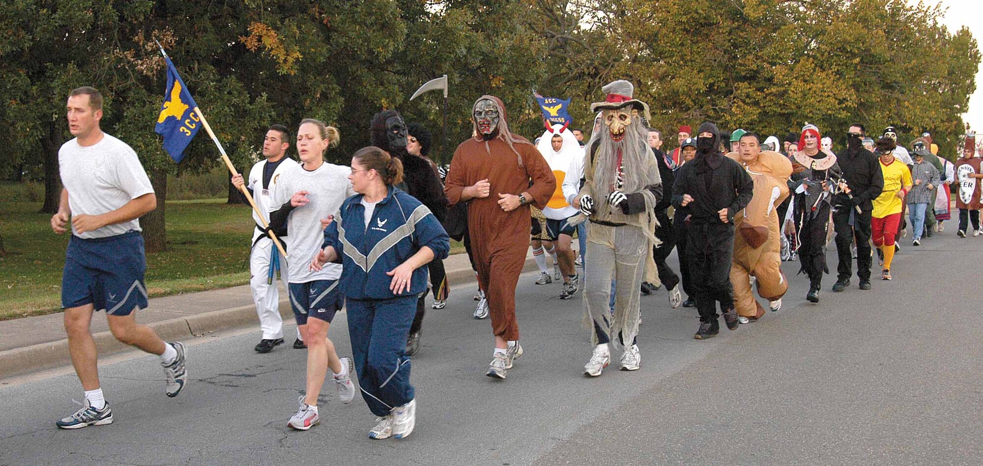 Halloween and physical fitness came together for the 3rd Combat Communications Group as Airmen and commanders did pre-dawn calisthenics and ran three miles across base for their monthly Stampede. A costume contest started the unusual workout and Halloween music floated over the Herd’s compound through the outdoor sound system. (Air Force photo by Margo Wright)