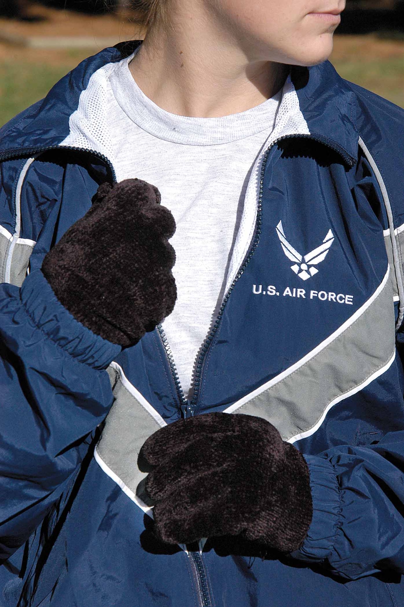 As temperatures drop, familiar tips for dressing apply to physical training gear, too. Dress in layers with breathable fabrics on the inside and wind resistant wear outside. (Air Force photo by Margo Wright)