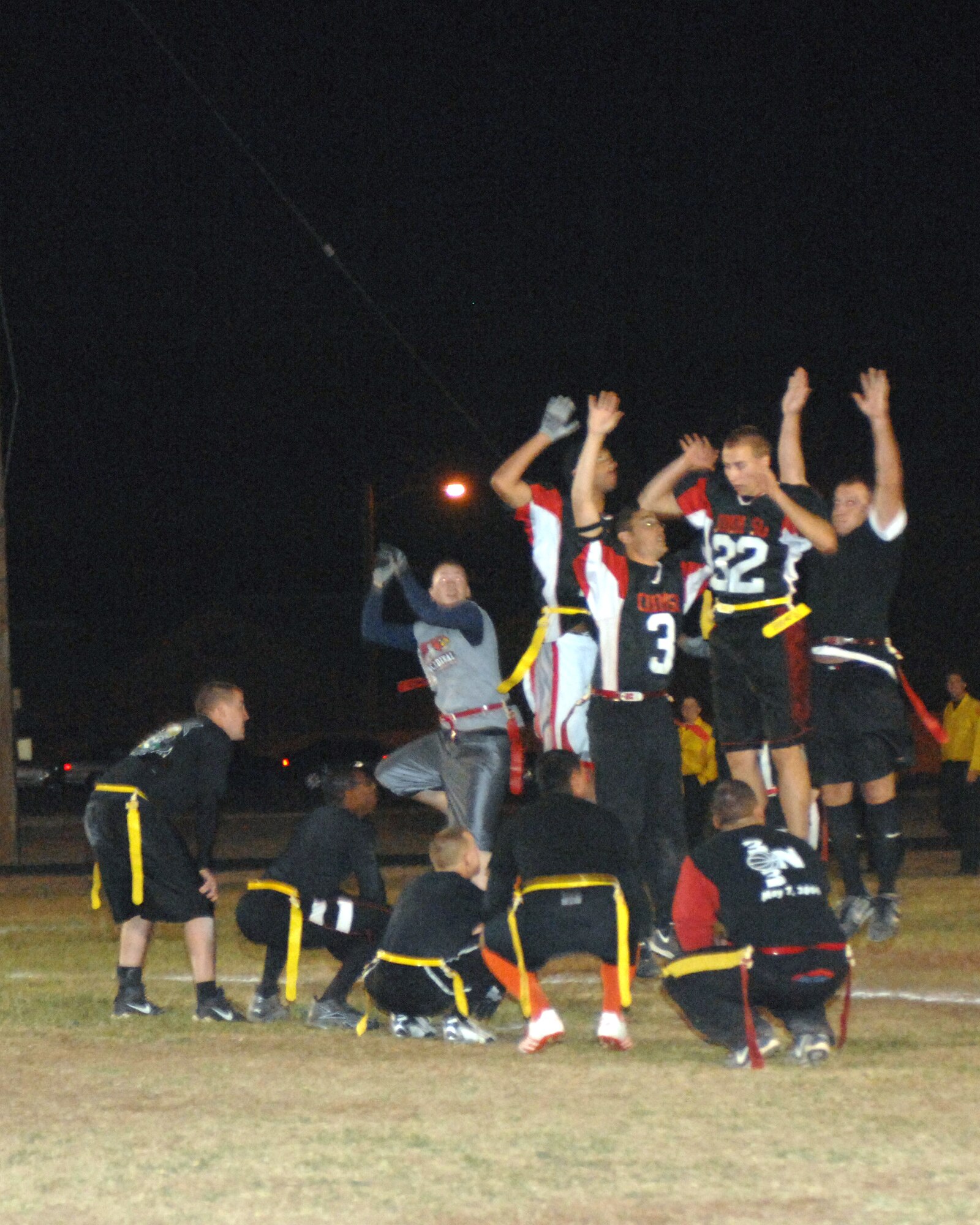 CANNON AIR FORCE BASE, N.M. -- The 27th Special Operations Communications Squadron team tries to block a kick by 27th Special Operations Civil Engineering Squadron during the intramural flag football championship game. SOCES won the game in overtime. (U.S. Air Force photo by Airman 1st Class Evelyn Chavez)